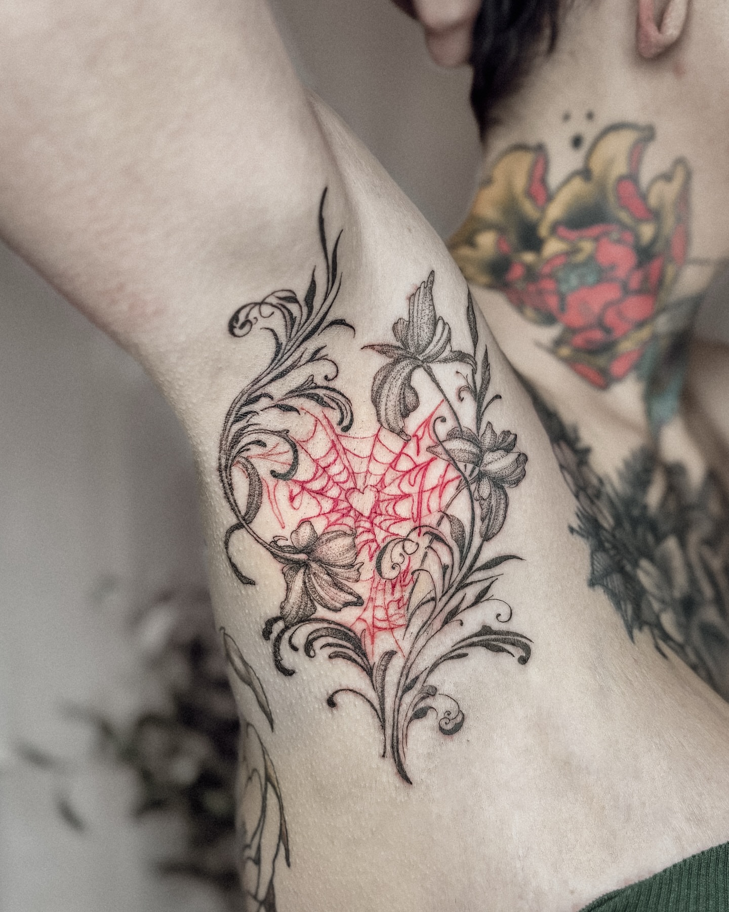 Broken heart with floral elements ornamental tattoo on the thigh by Ayauna Mai