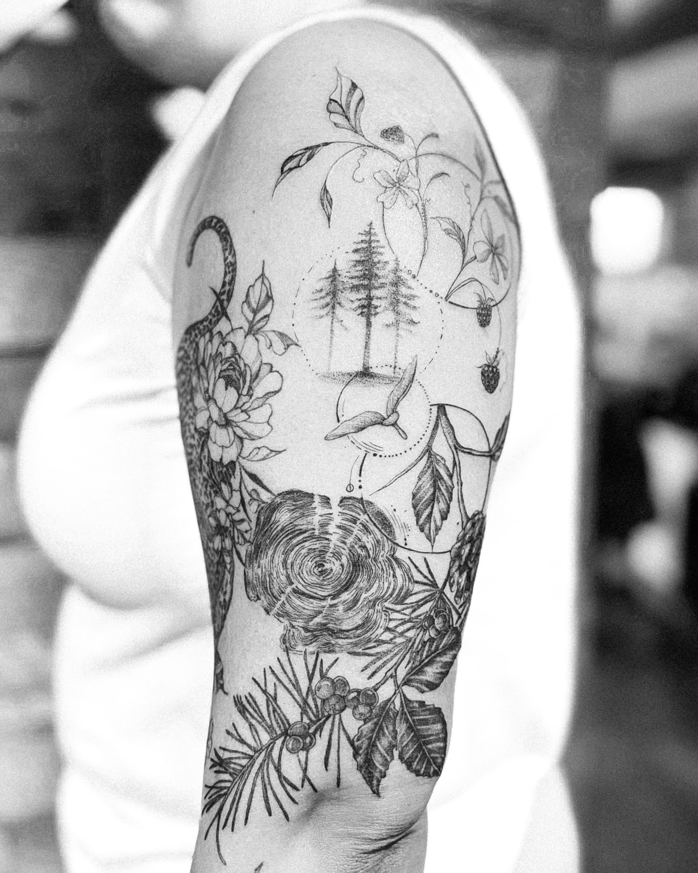 Forest and flora dotwork tattoo on the forearm by Ayauna Mai