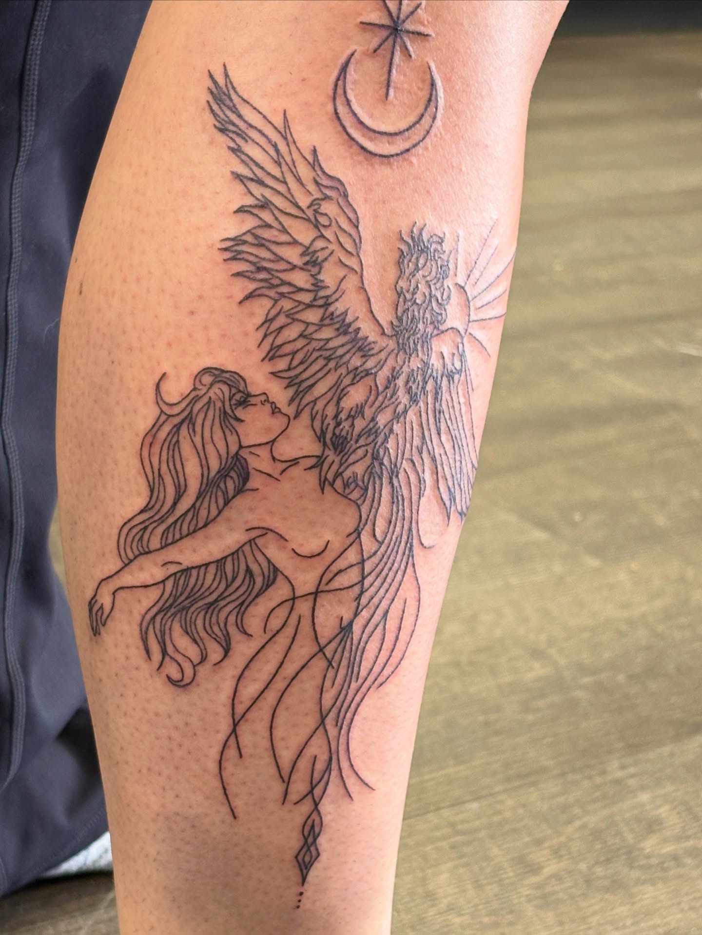 Mermaid and phoenix realism tattoo on the thigh by Tori Anderson, Minneapolis, Minnesota