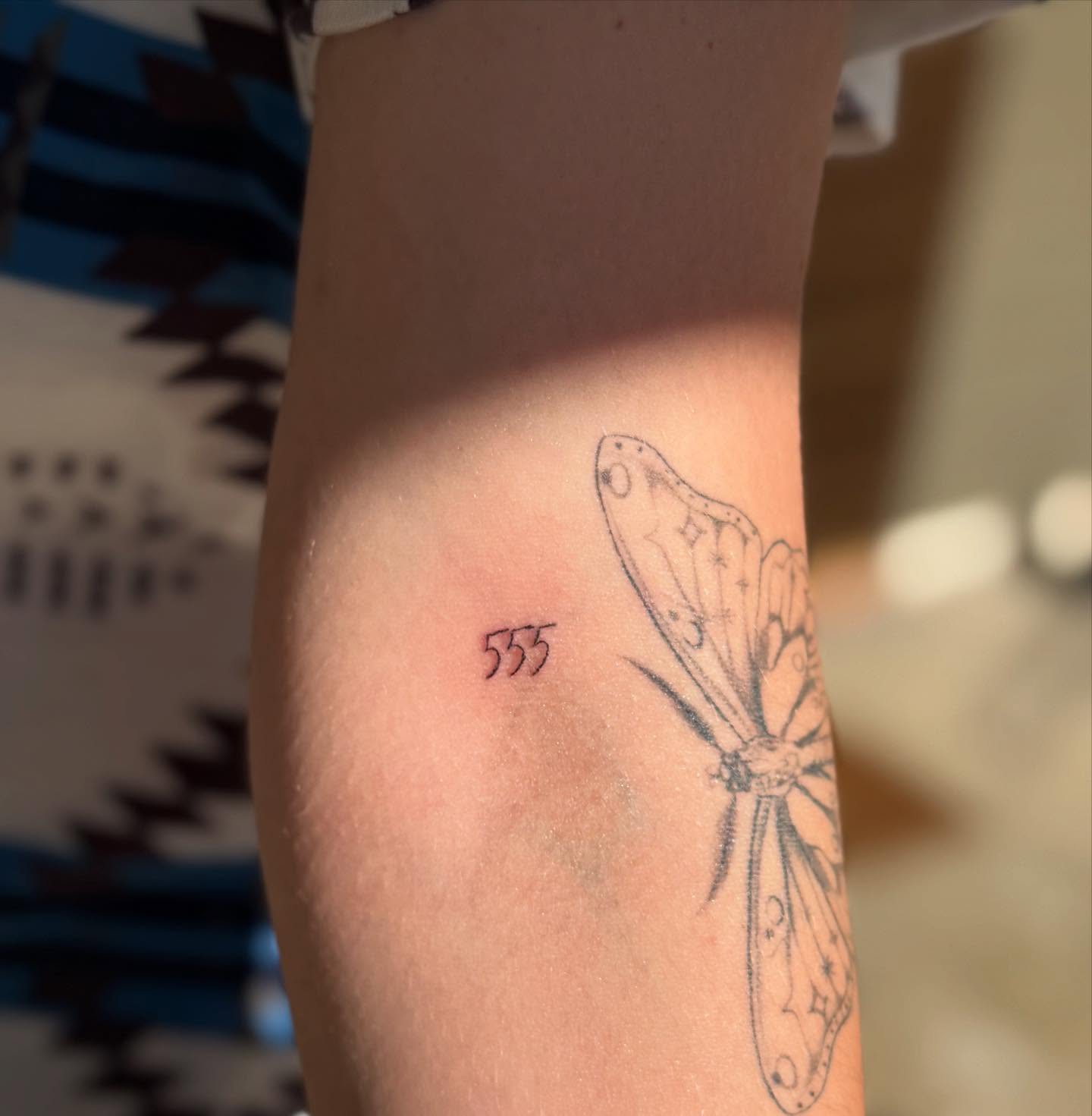 Butterfly black and grey tattoo on the forearm by Kylee Snow
