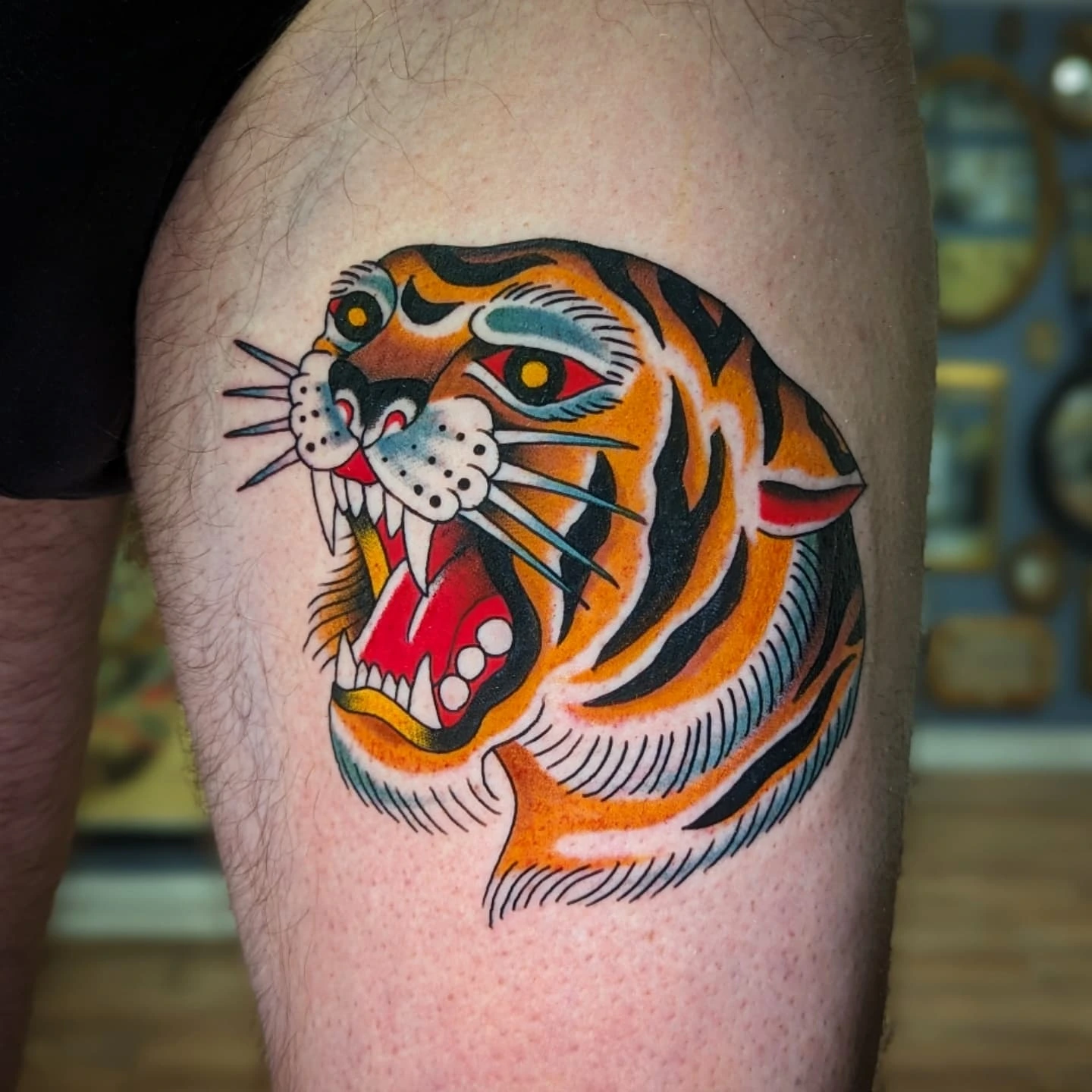 Tiger American traditional tattoo on the thigh by joseph palladino