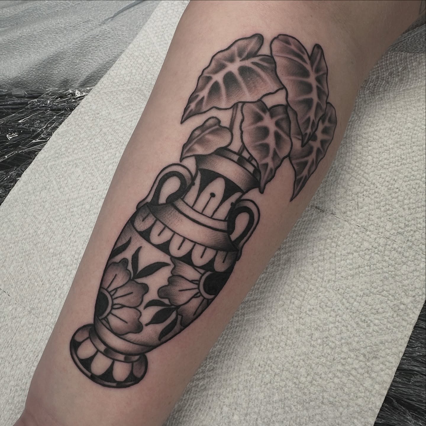 Knife and leaves American traditional tattoo on the forearm by Heather Cherish