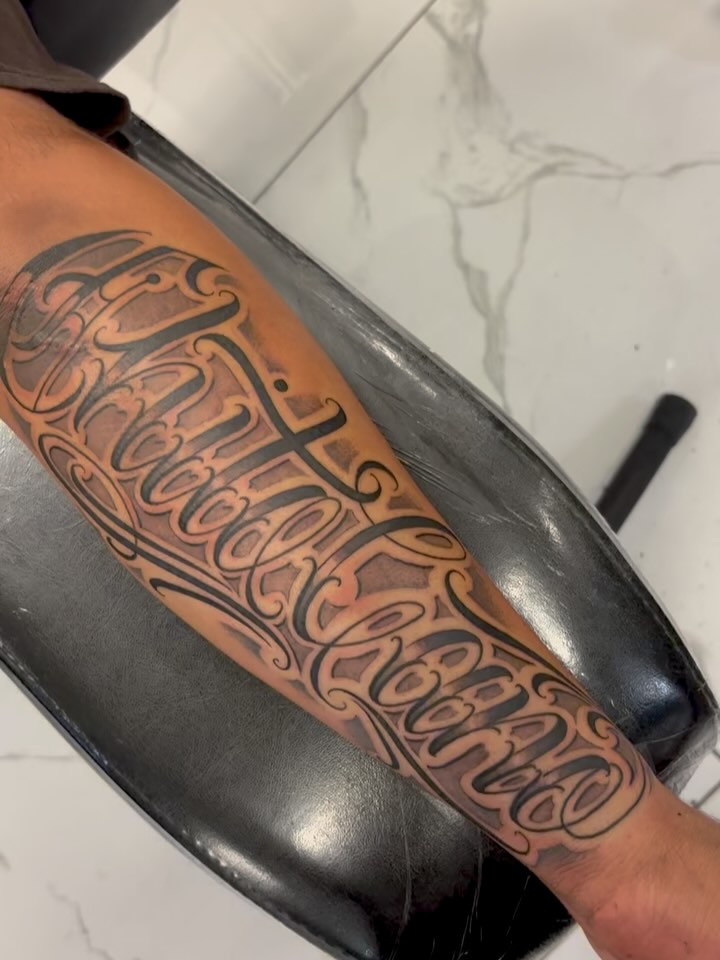 Script lettering lettering script tattoo on the forearm by Cristiano Ochoa, Elk Grove, California