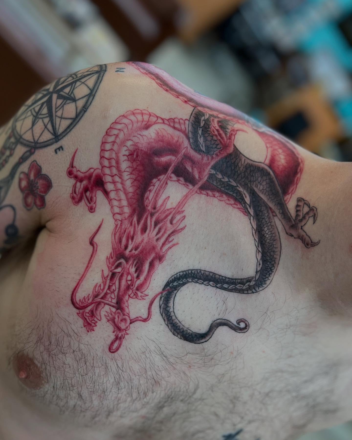 Dragon American traditional tattoo on the chest by Levi Sawdon, Everett, Washington