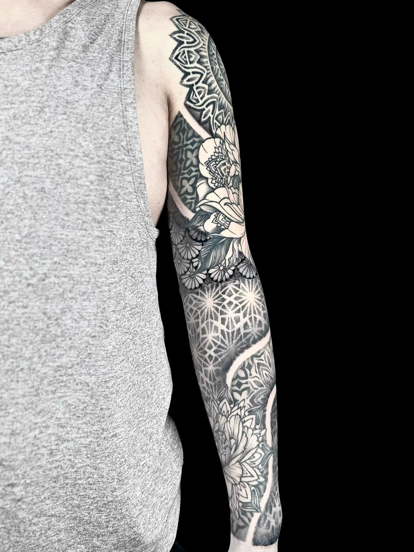 Geometric patterns and floral motifs geometric tattoo on the forearm by Abi