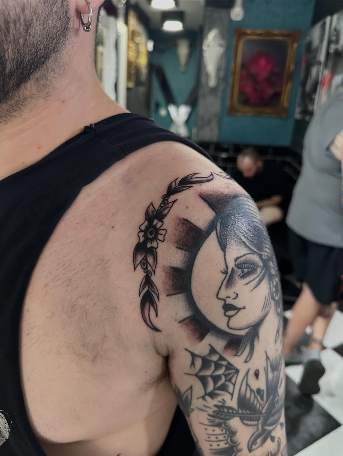 Woman's face realism tattoo on the shoulder by Kunaytattoo