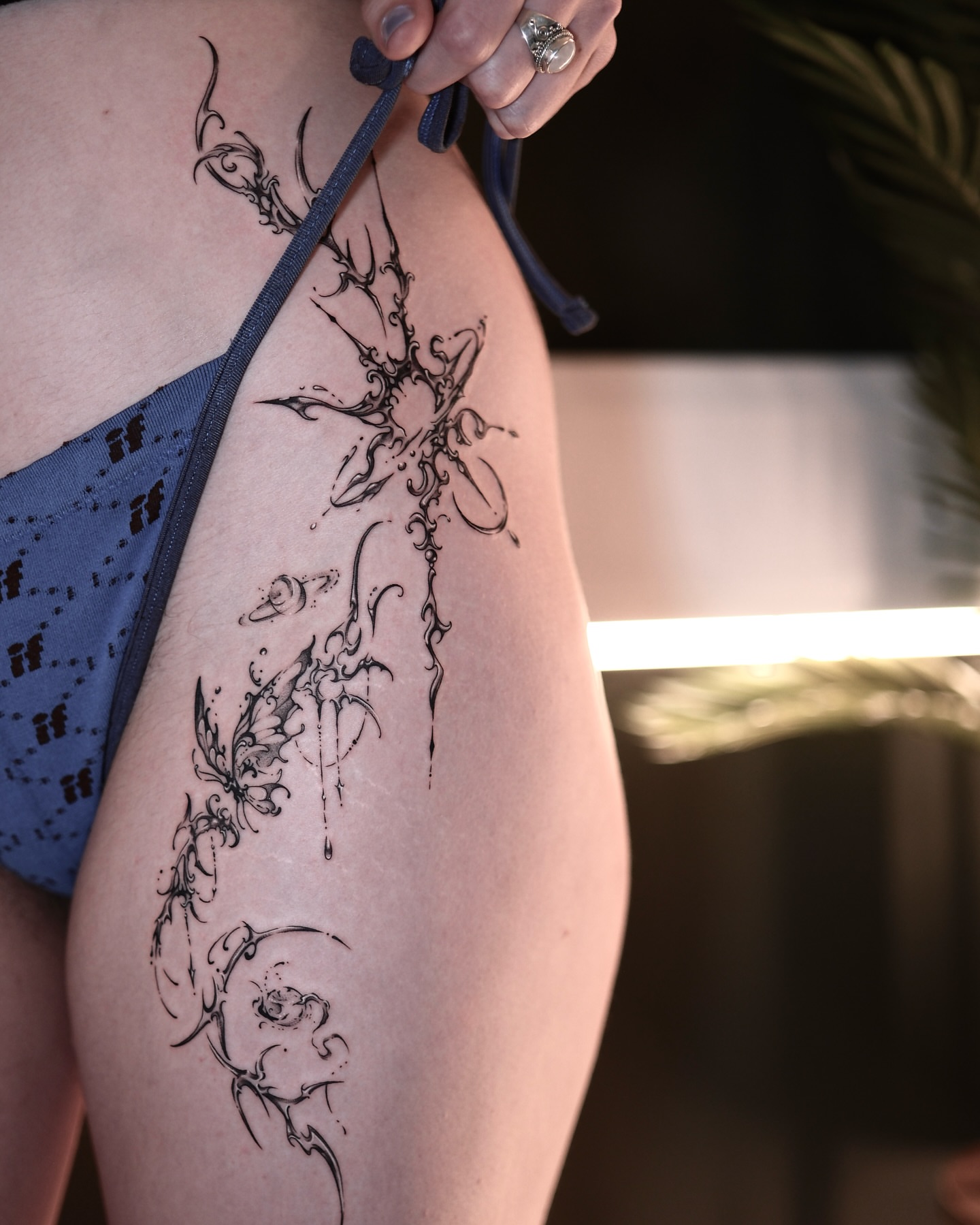Antlers and floral tribal tattoo on the thigh by IVY