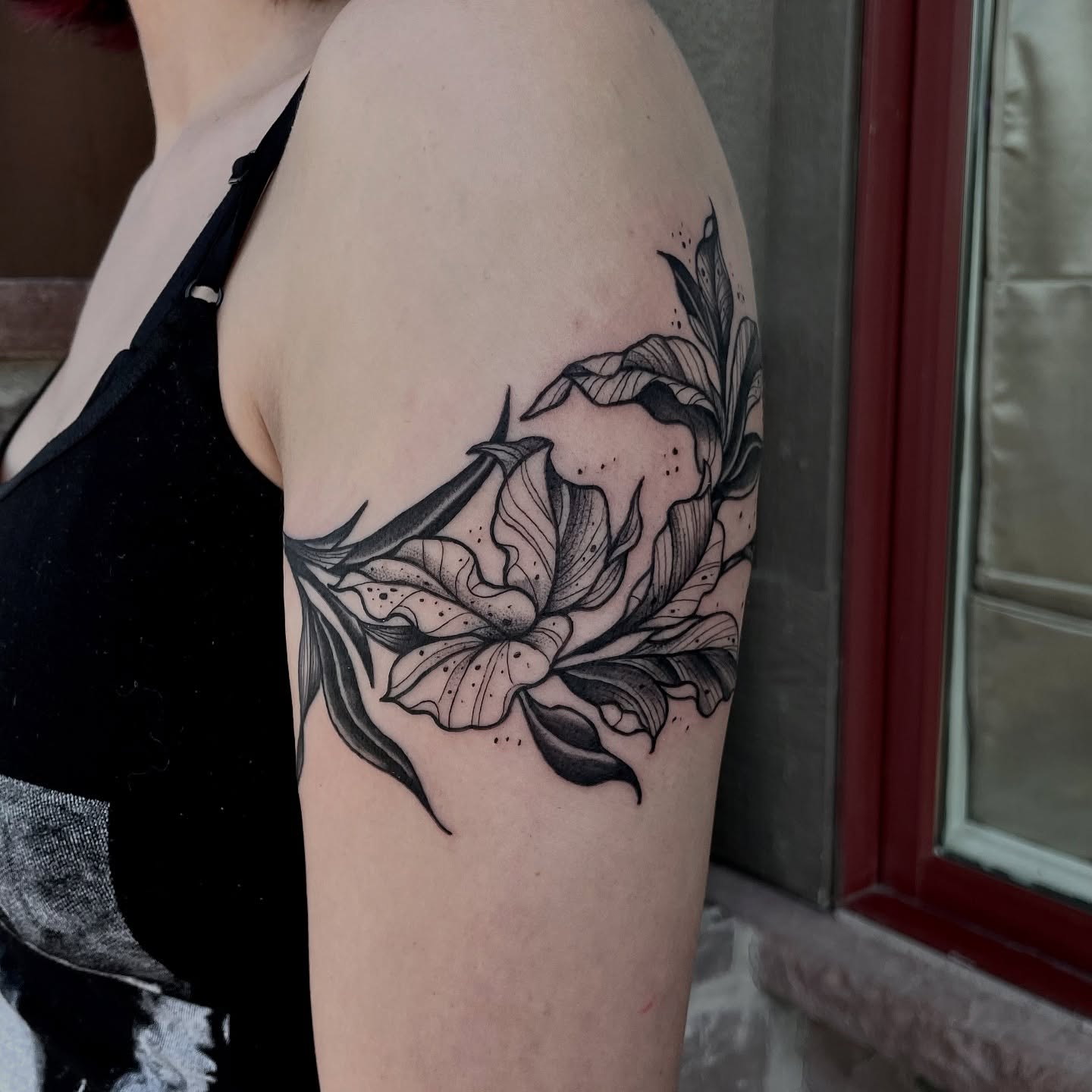 Lily dotwork tattoo on the forearm by Tattoo Artist