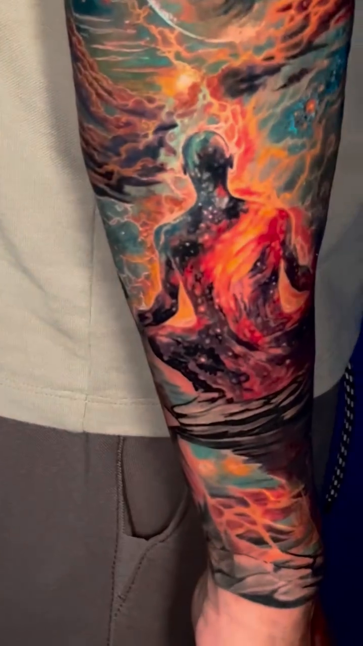 Meditating figure with cosmic background realism tattoo by James Moyer