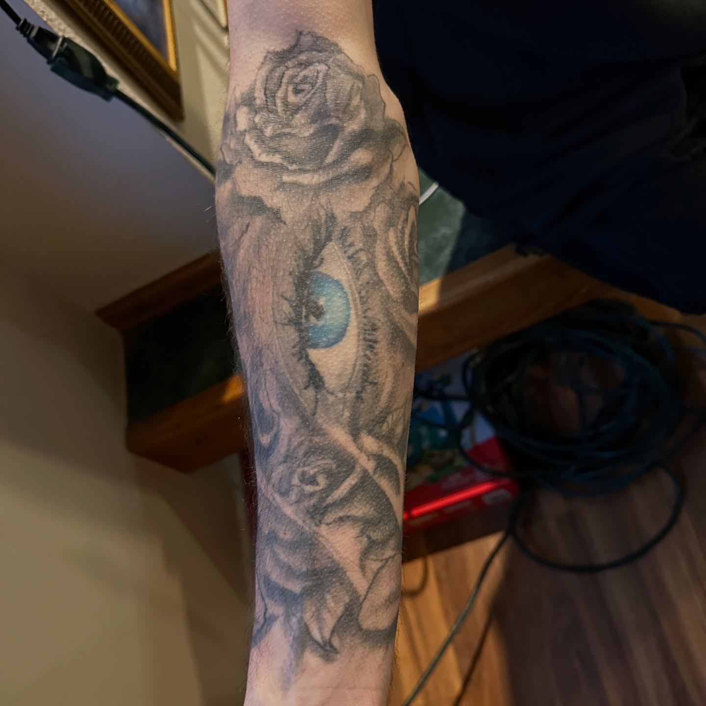 Rose and eye realism tattoo on the forearm by Jason