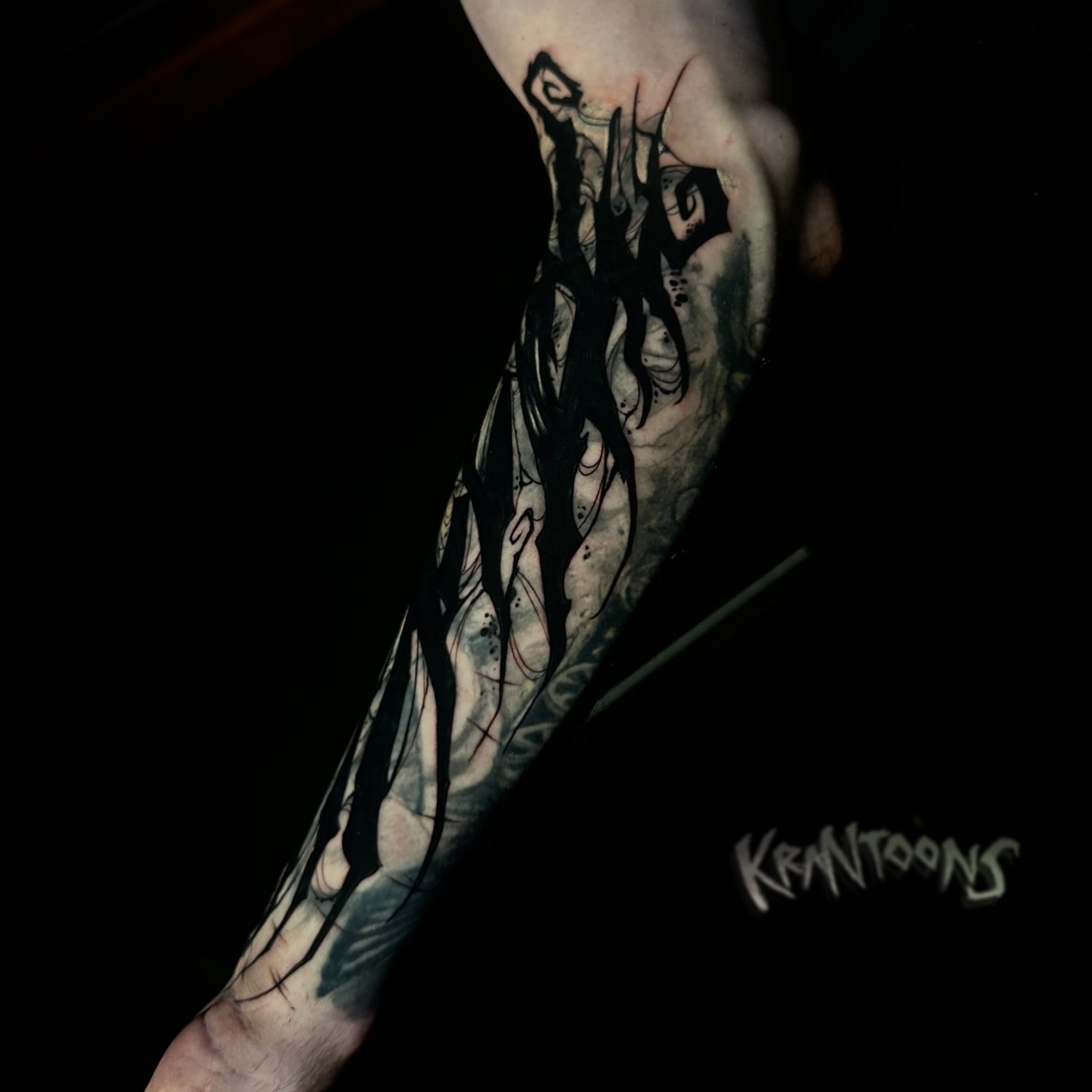 Abstract design black and grey tattoo on the forearm by Jason