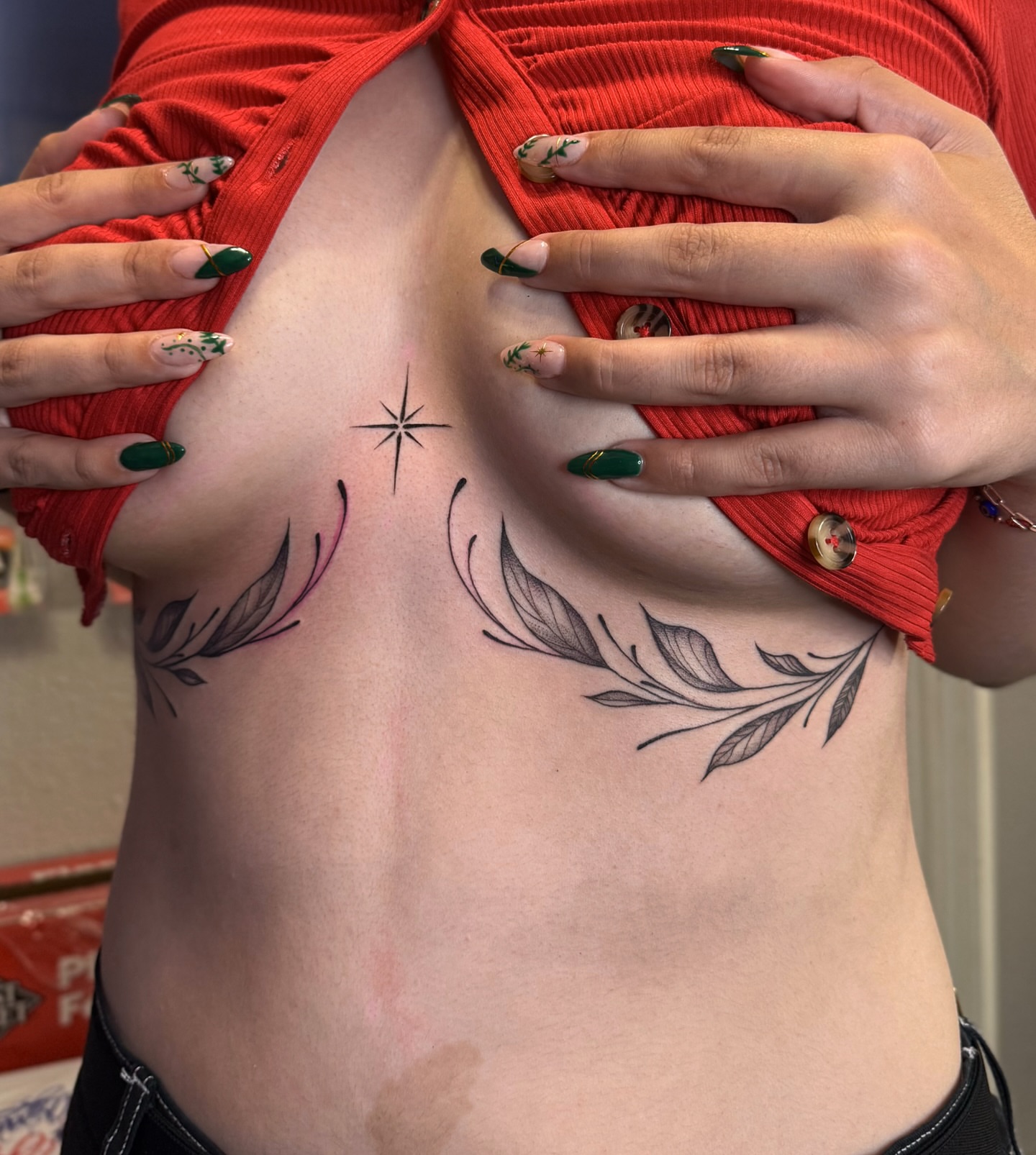 Floral and star black and grey tattoo on the ribs by Dee, San Diego, California
