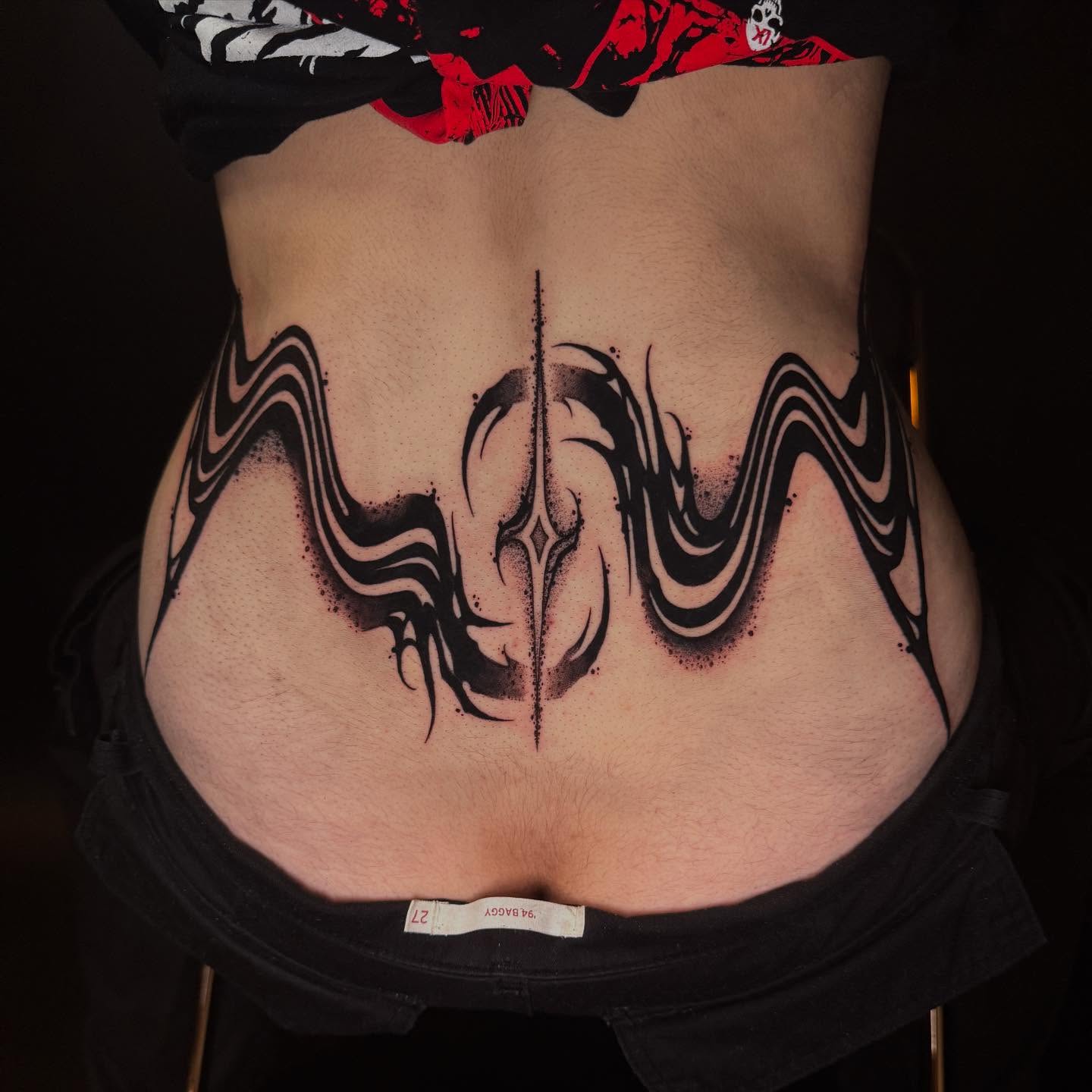 Tribal design tribal tattoo on the torso by Dylan Orbock, Berkeley, California