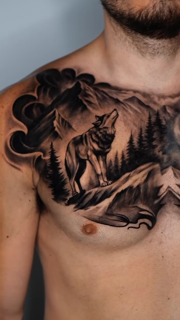Wolf in mountain landscape realism tattoo by Tattoo Artist Miami & la, Hollywood, Florida