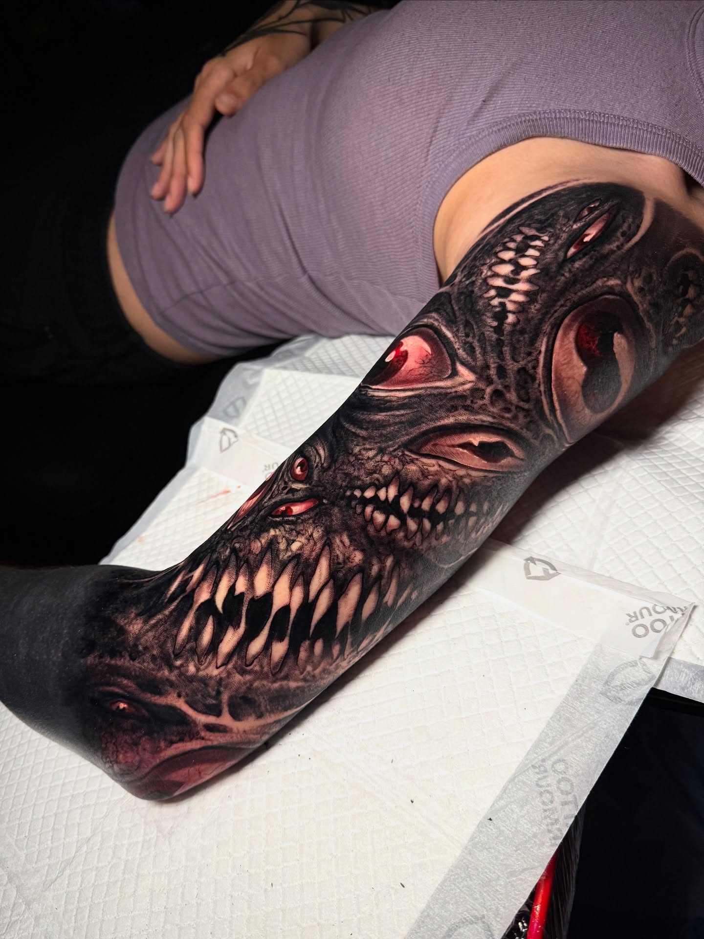 Demon head dark realism tattoo on the forearm by Brandon Herrera