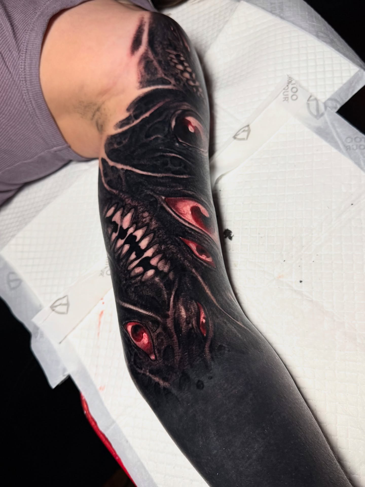 Cyborg face dark realism tattoo on the forearm by Brandon Herrera