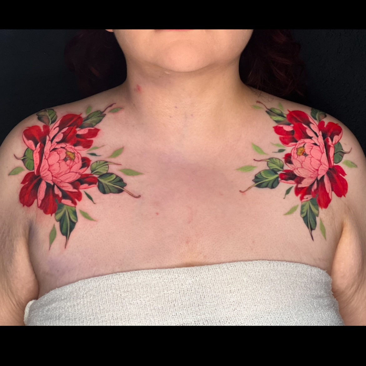 Floral bouquet realism tattoo on the chest by Jordan