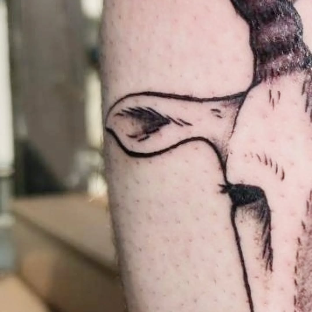 Cow face fine line tattoo on the forearm by Karson