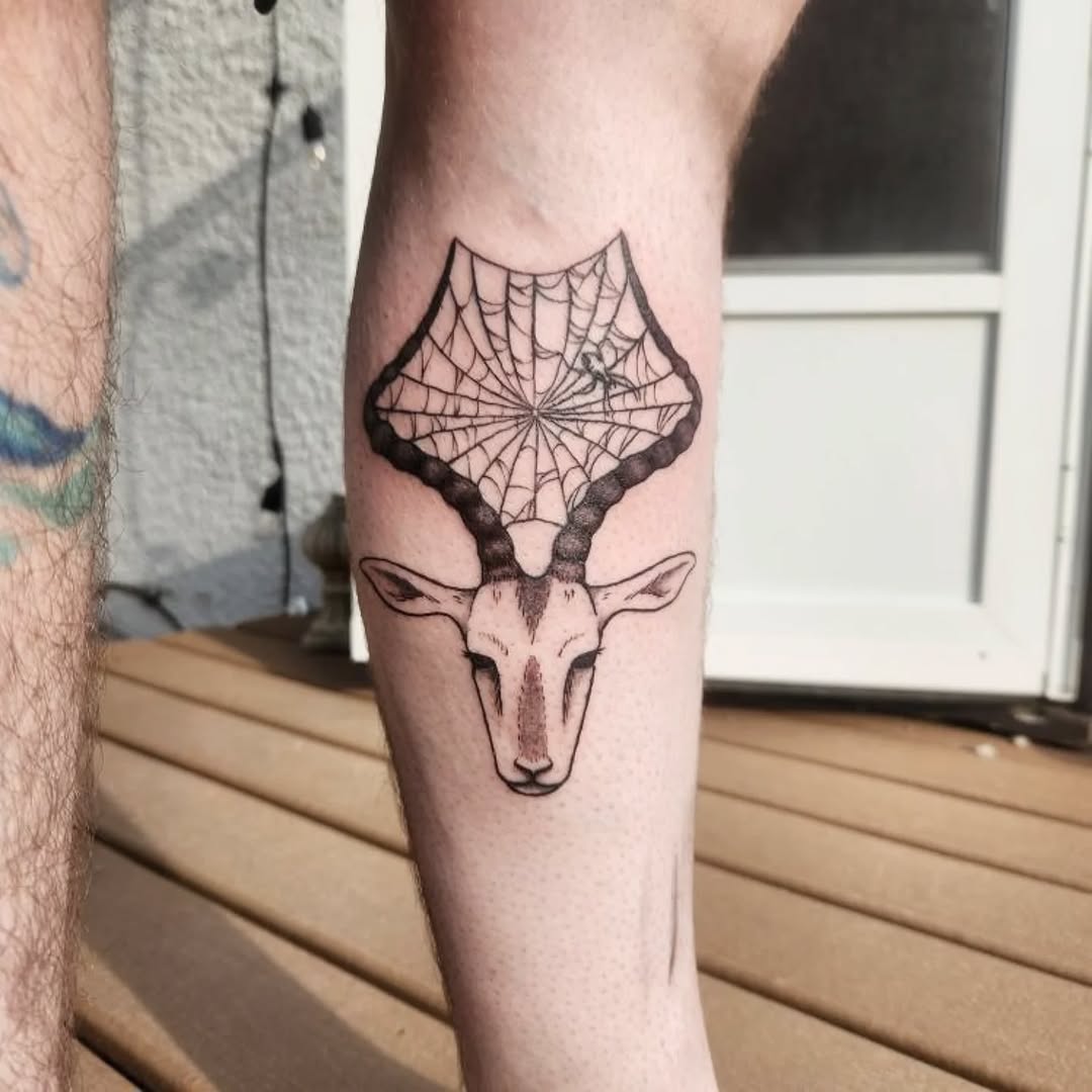 Deer head with spiderweb antlers fine line tattoo on the forearm by Karson