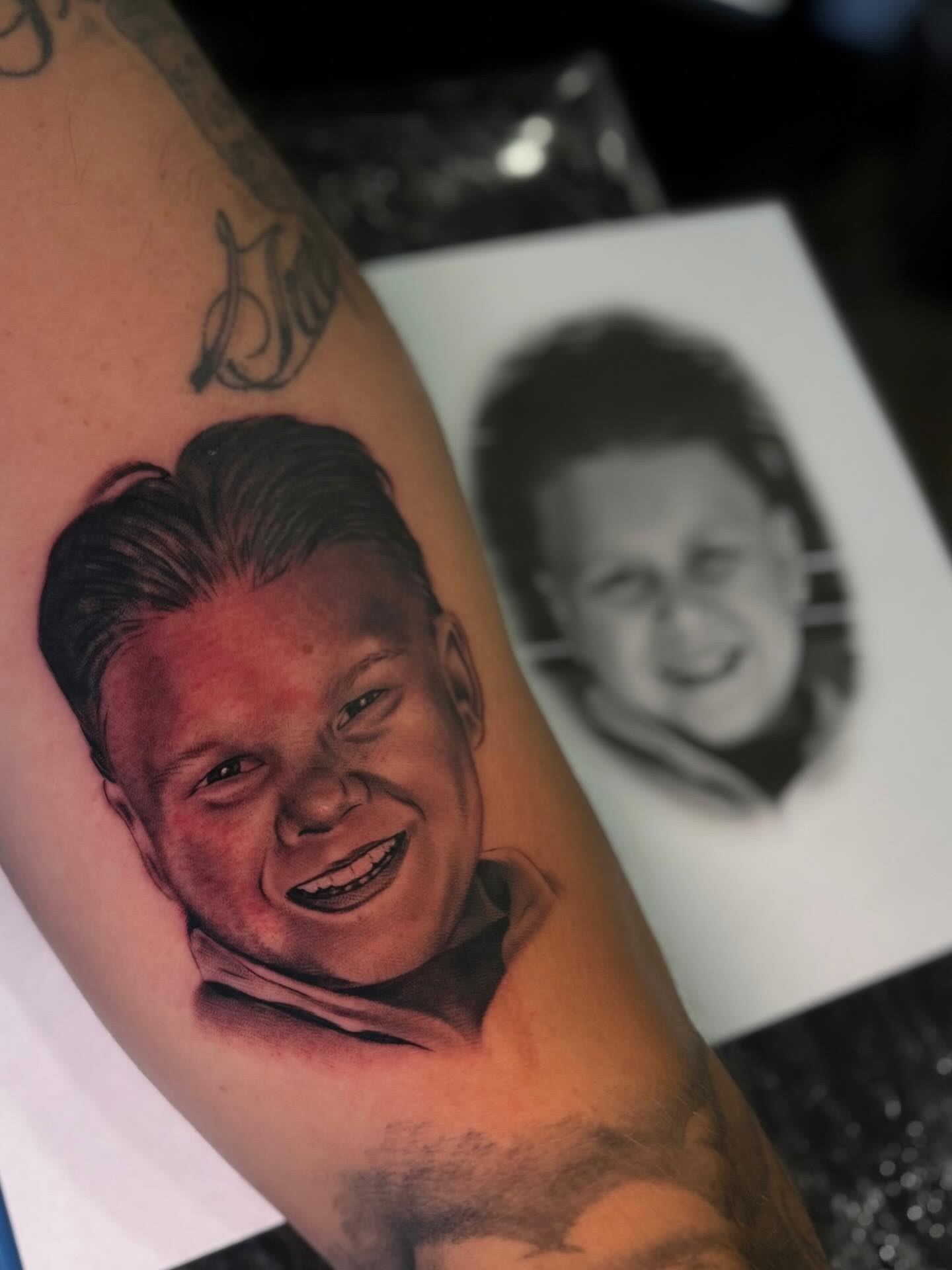 Portrait realism tattoo on the forearm by Jose Mendoza Torres