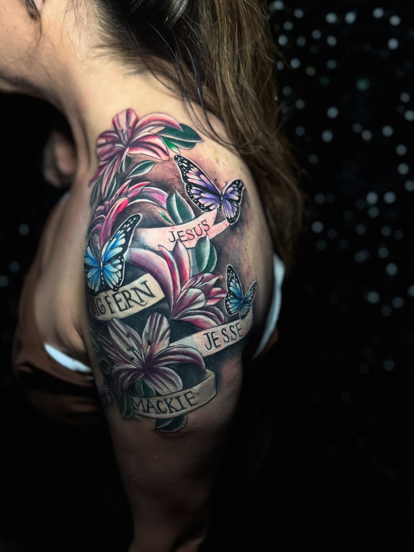 Lilies and butterflies American traditional tattoo on the shoulder by Tattoo Artist