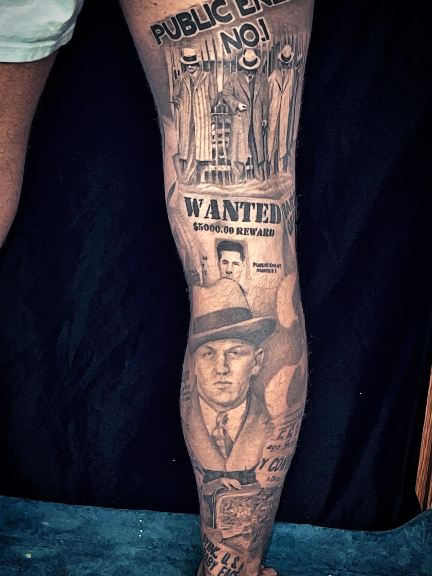 Gangster wanted poster American traditional tattoo on the forearm by Josh Williams, Chattanooga, Tennessee