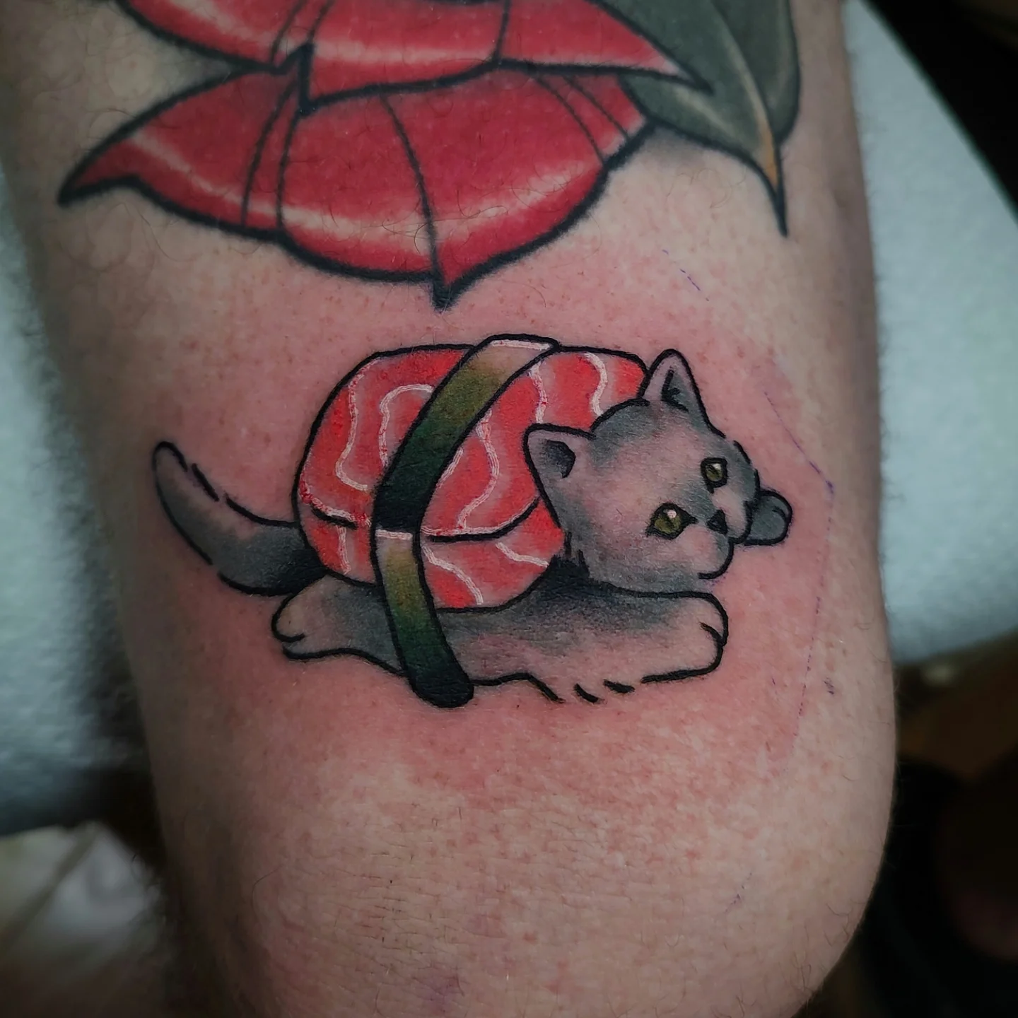 Cat sushi dotwork tattoo on the forearm by Hope Higgins