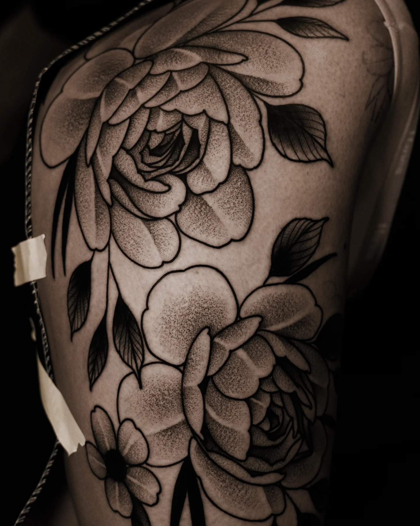 Floral bouquet dotwork tattoo on the shoulder by Craig St Peter, Kansas City, Missouri