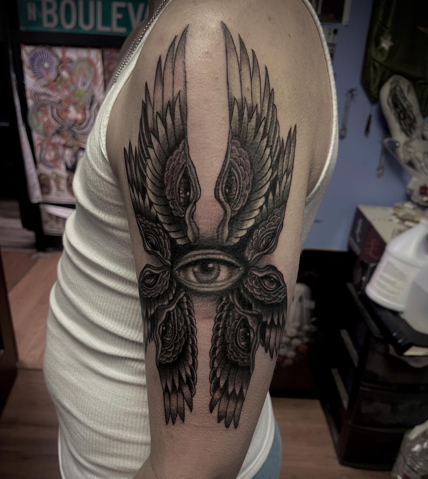 Eye with wings realism tattoo on the forearm by Ashly Hutchens, Richmond, Virginia