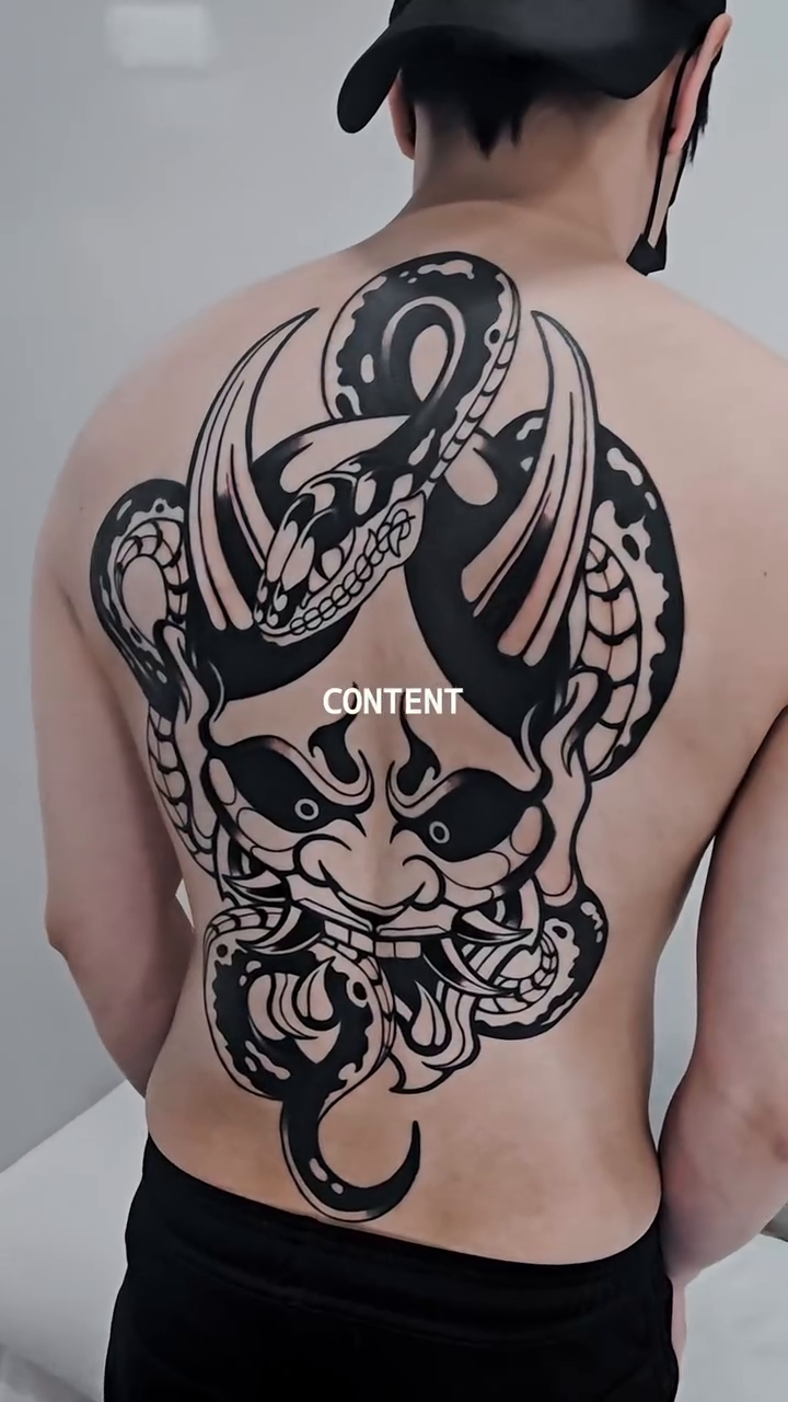 Demon face with snake blackwork tattoo by Jeremy "Jerms" Camposanto