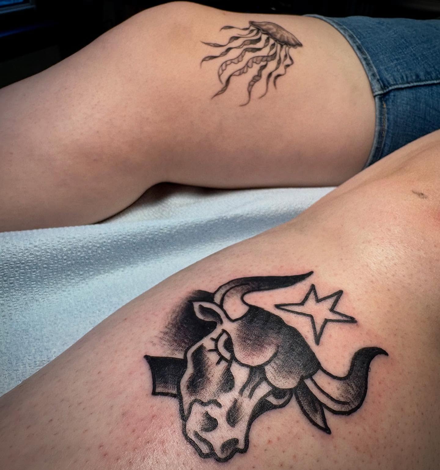 Bull head with star black and grey tattoo on the thigh by Nolan Croteau