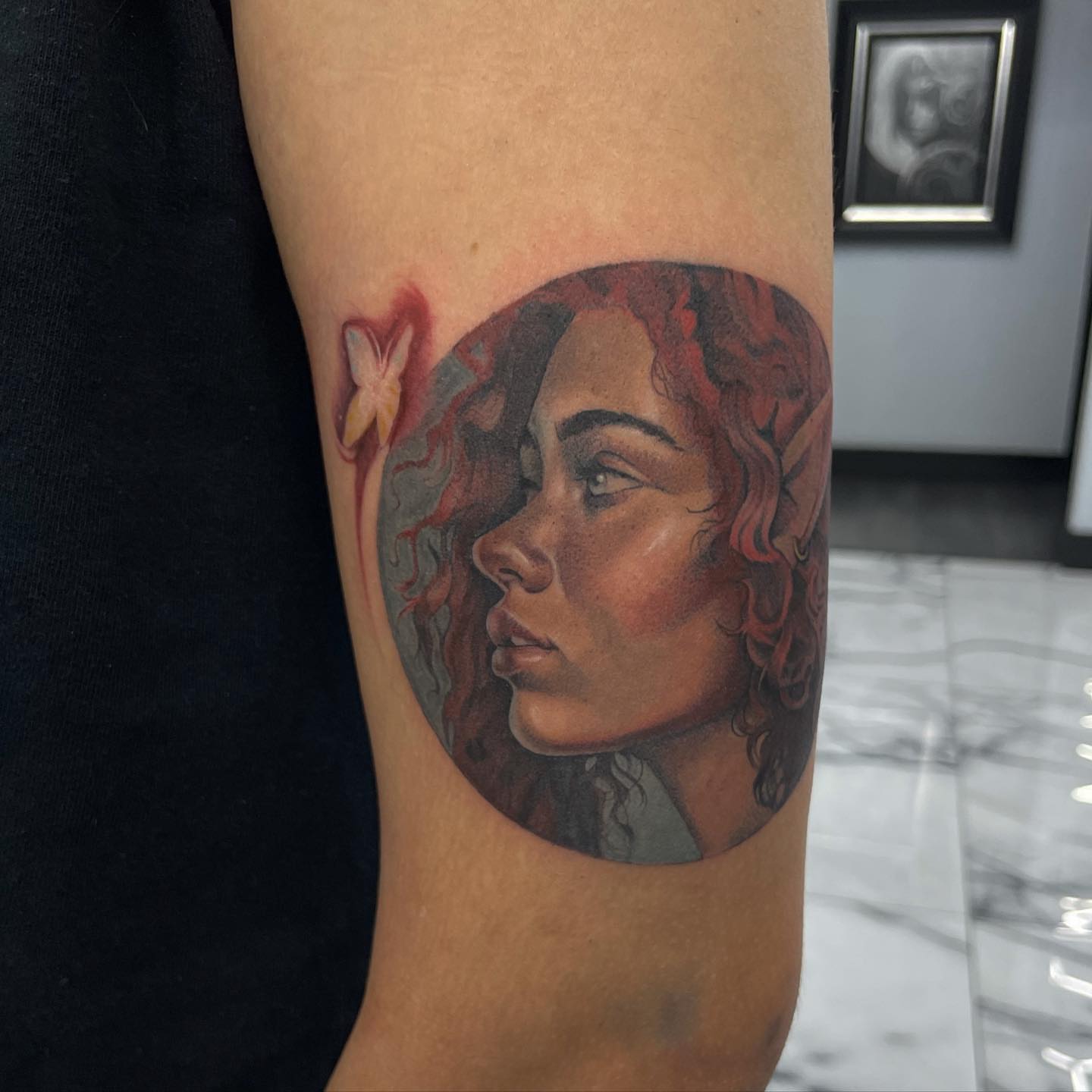 Woman's profile realism tattoo on the forearm by Austin Jones