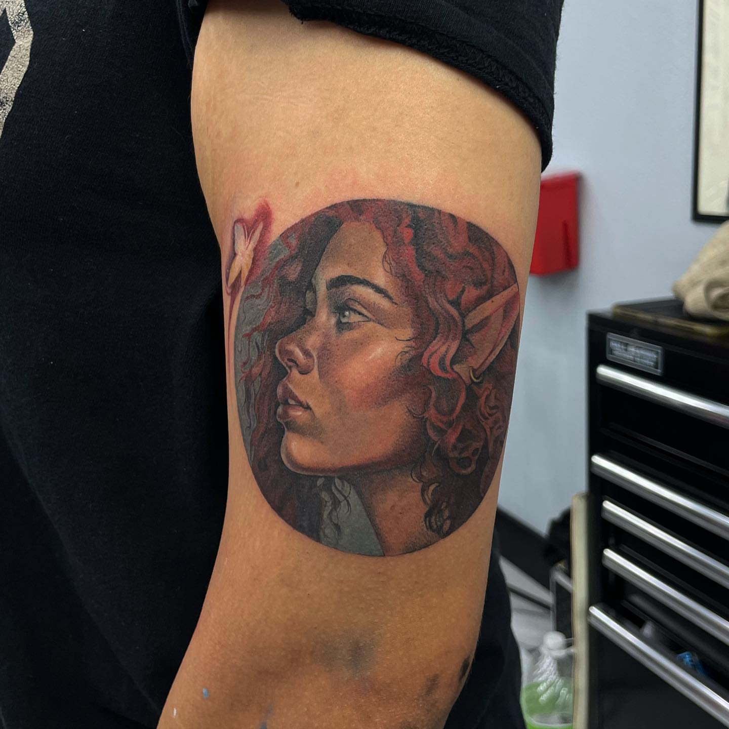 Woman's profile realism tattoo on the forearm by Austin Jones