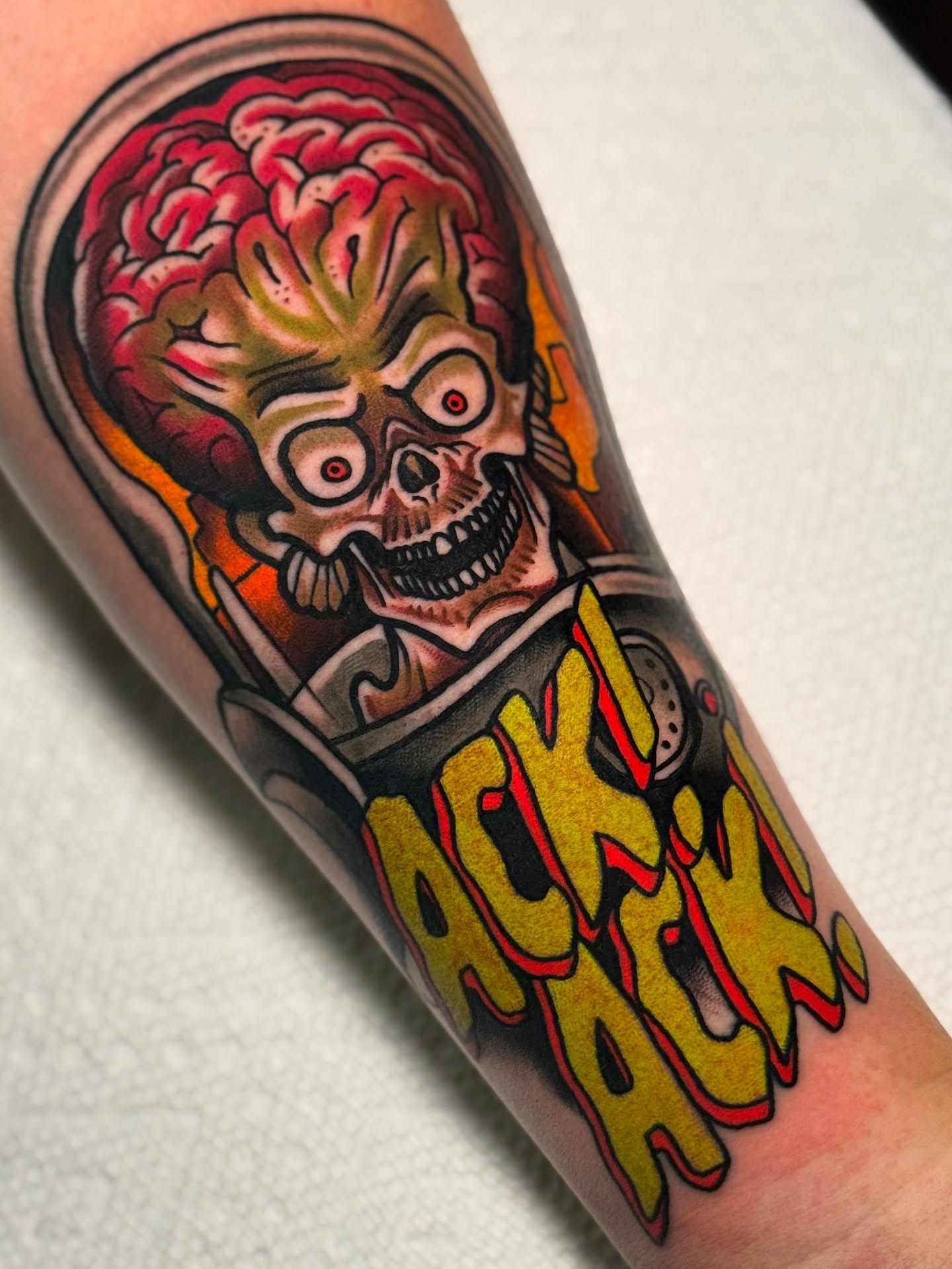 Skull with flame American traditional tattoo on the forearm by Cory Cartwright