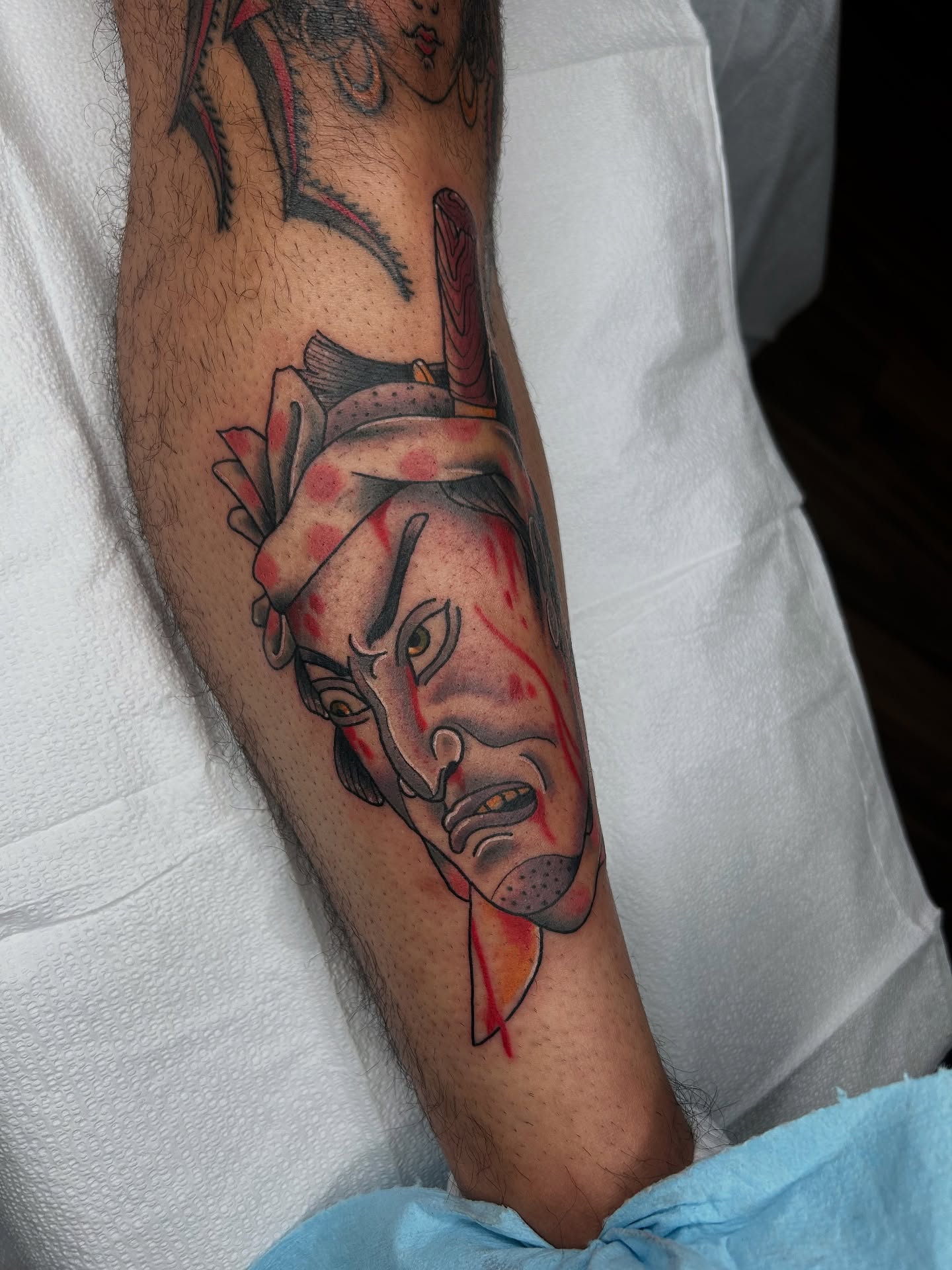 Man's head realism tattoo on the forearm by Noah Crow