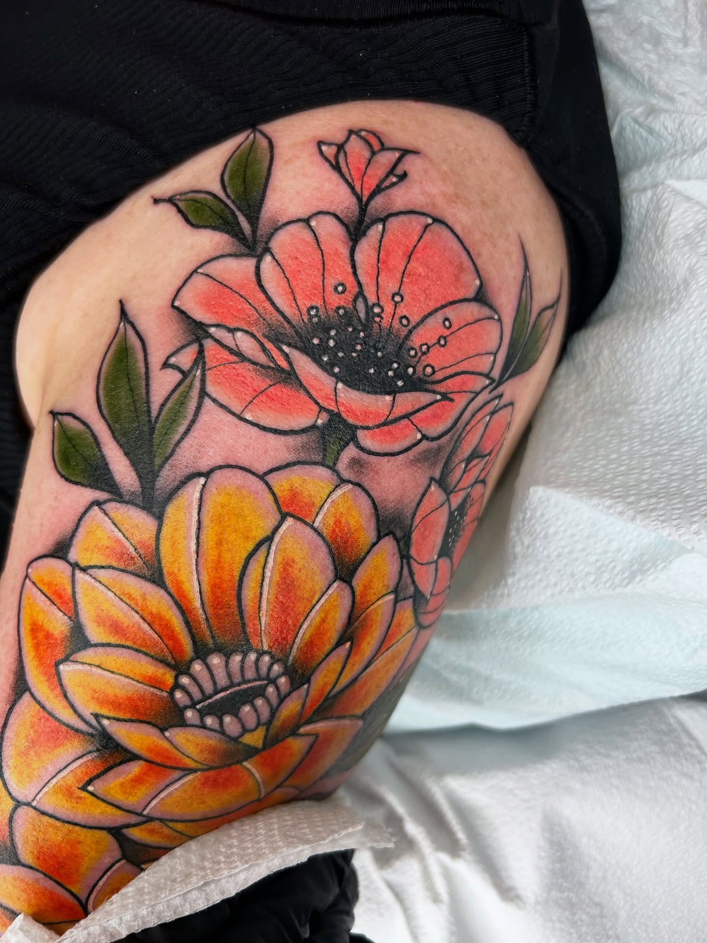 Flowers dotwork tattoo on the thigh by Noah Crow