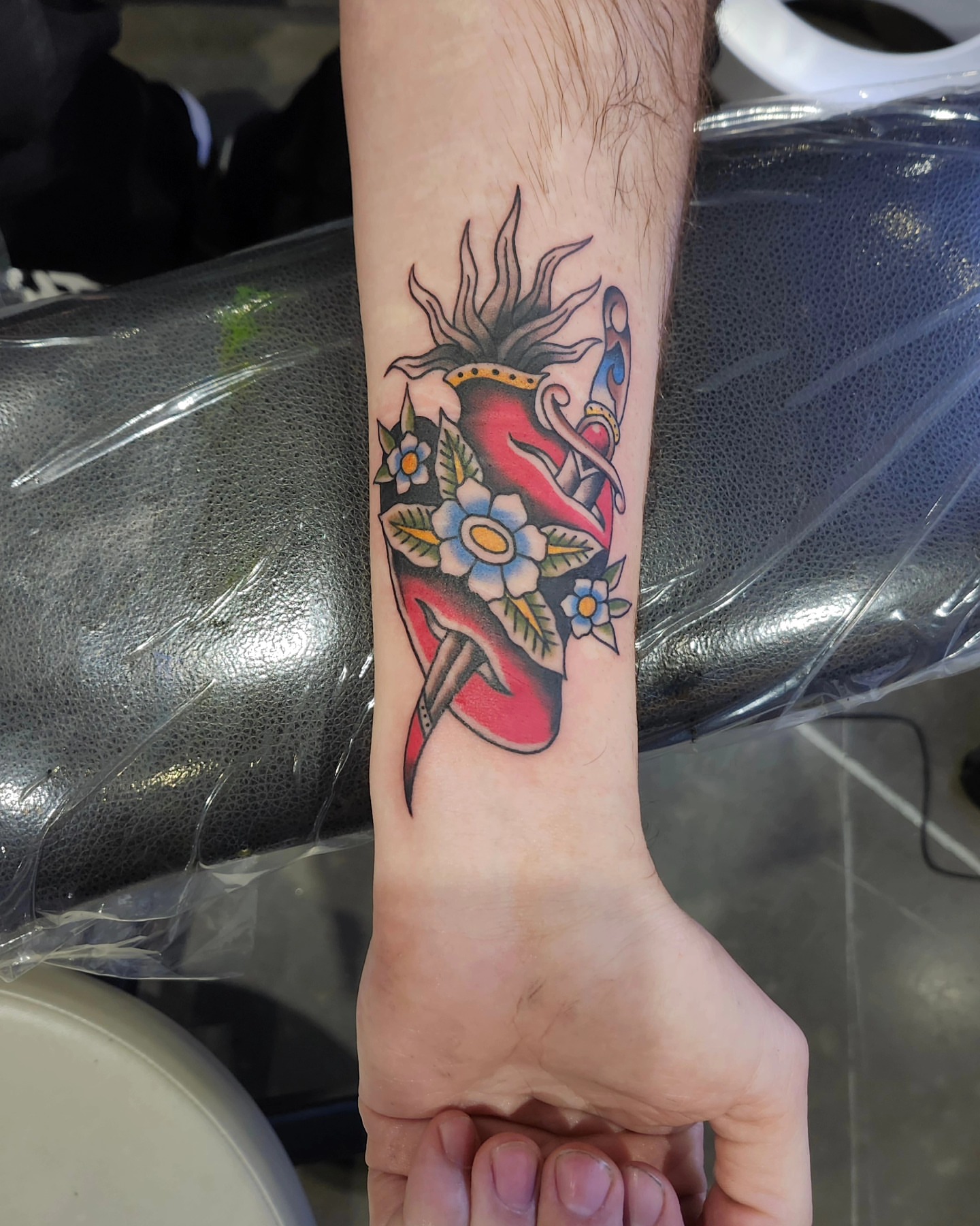 Floral and bird American traditional tattoo on the forearm by Herc