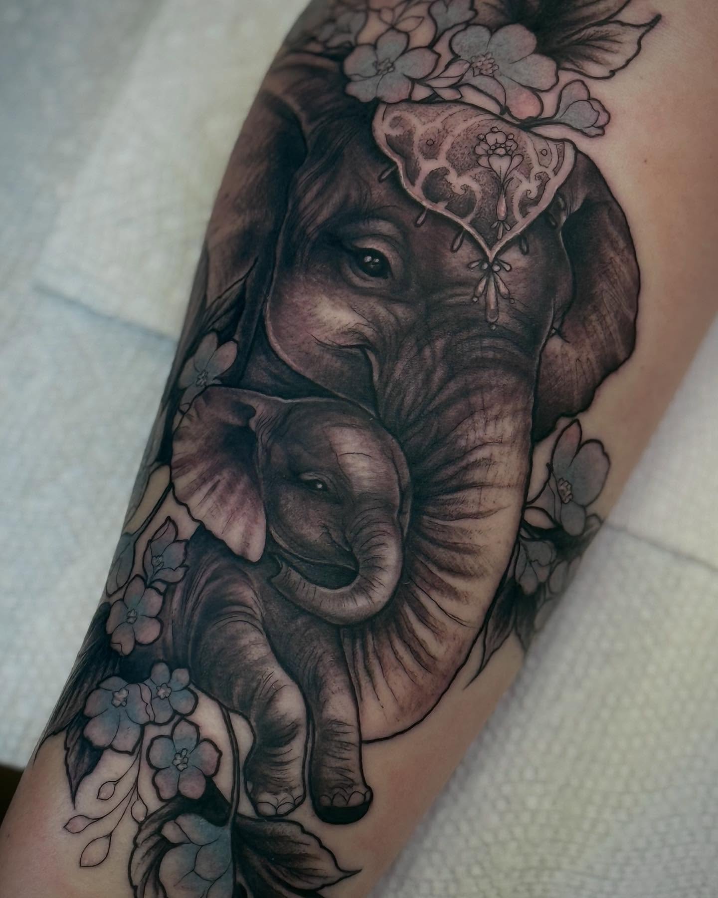 Elephant family realism tattoo on the forearm by Espinal