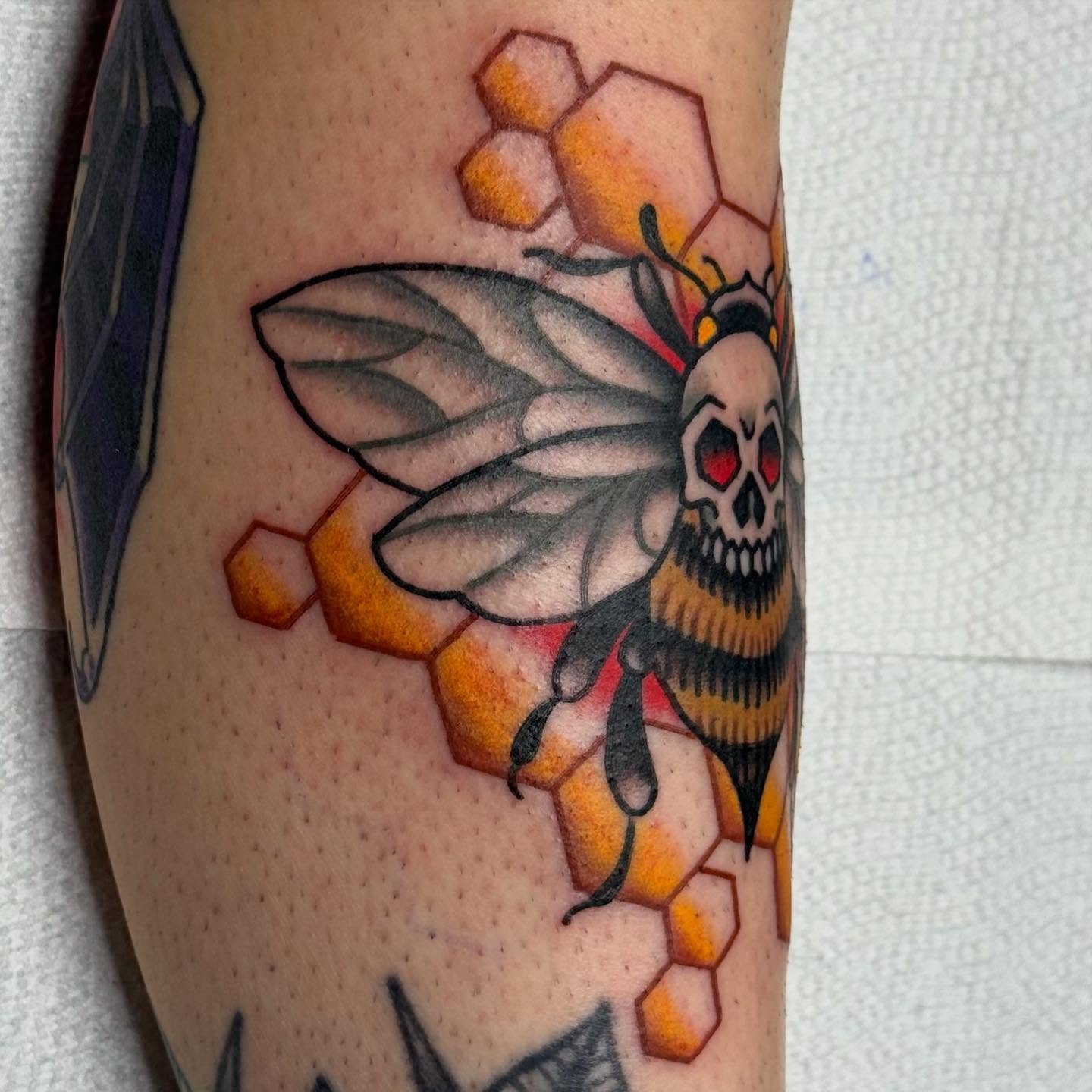 Bee with skull head American traditional tattoo on the forearm by David Gottschalk