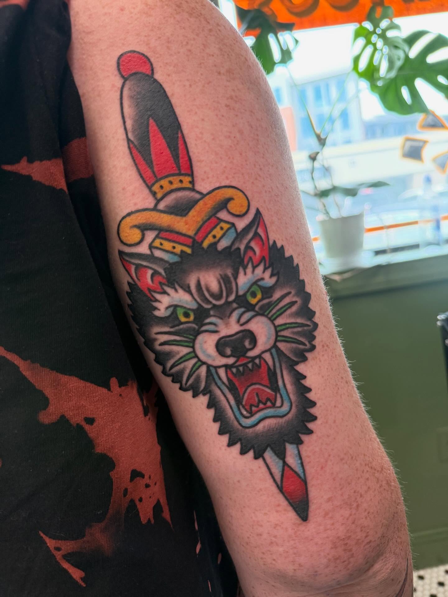 Wolf jester hat American traditional tattoo on the forearm by Blake Owens, Nashville, Tennessee
