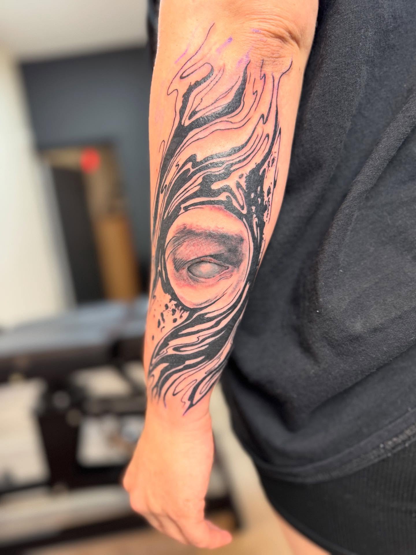 Eye realism tattoo on the forearm by Cohen