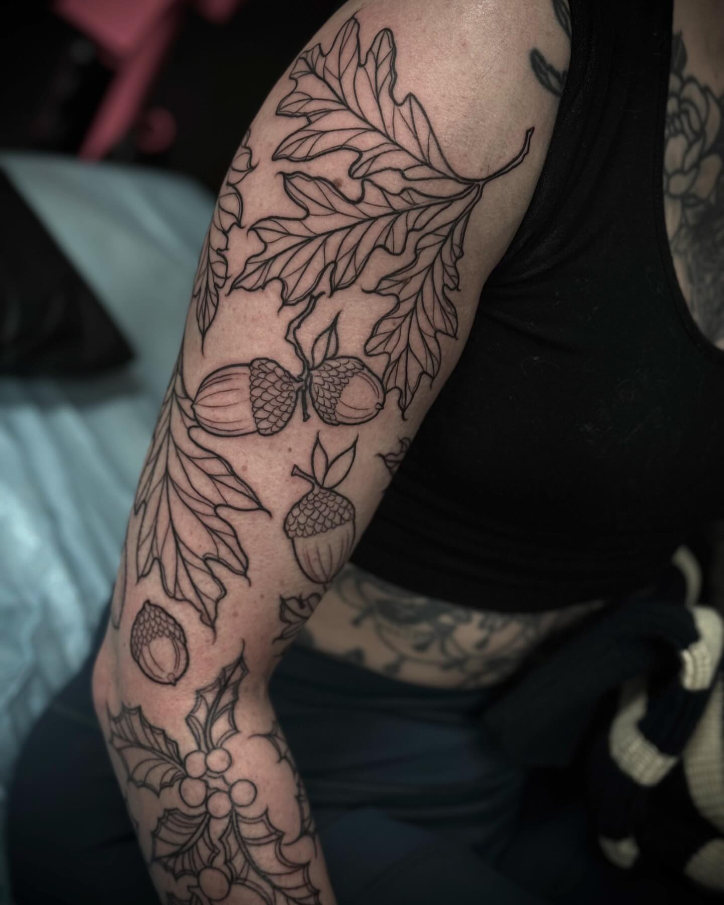 Acorns and leaves black and grey tattoo on the forearm by M A R I B e T H▪️k L A A R