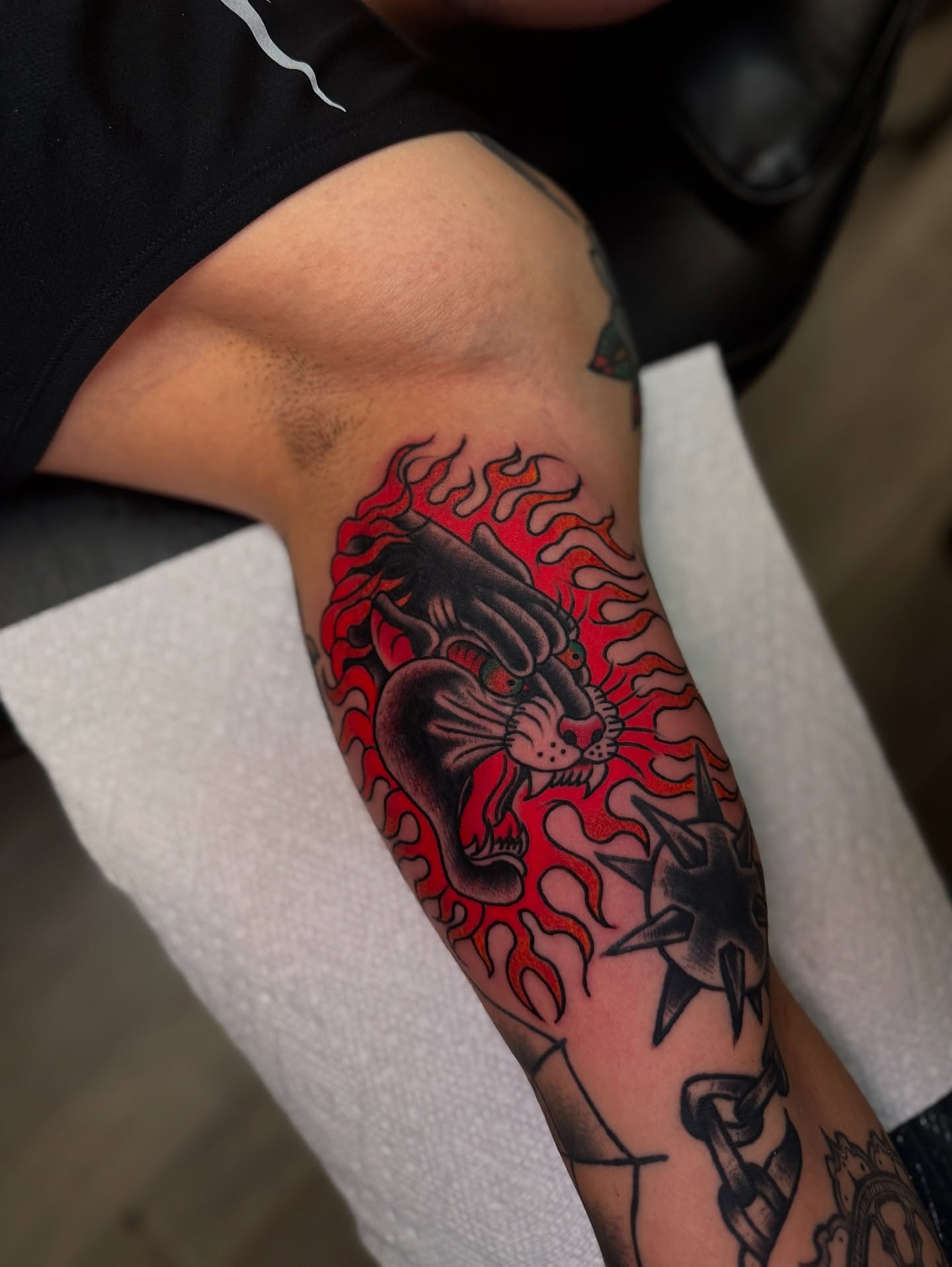 Lion and flames American traditional tattoo on the forearm by Preston-NJ Tattoo Artist