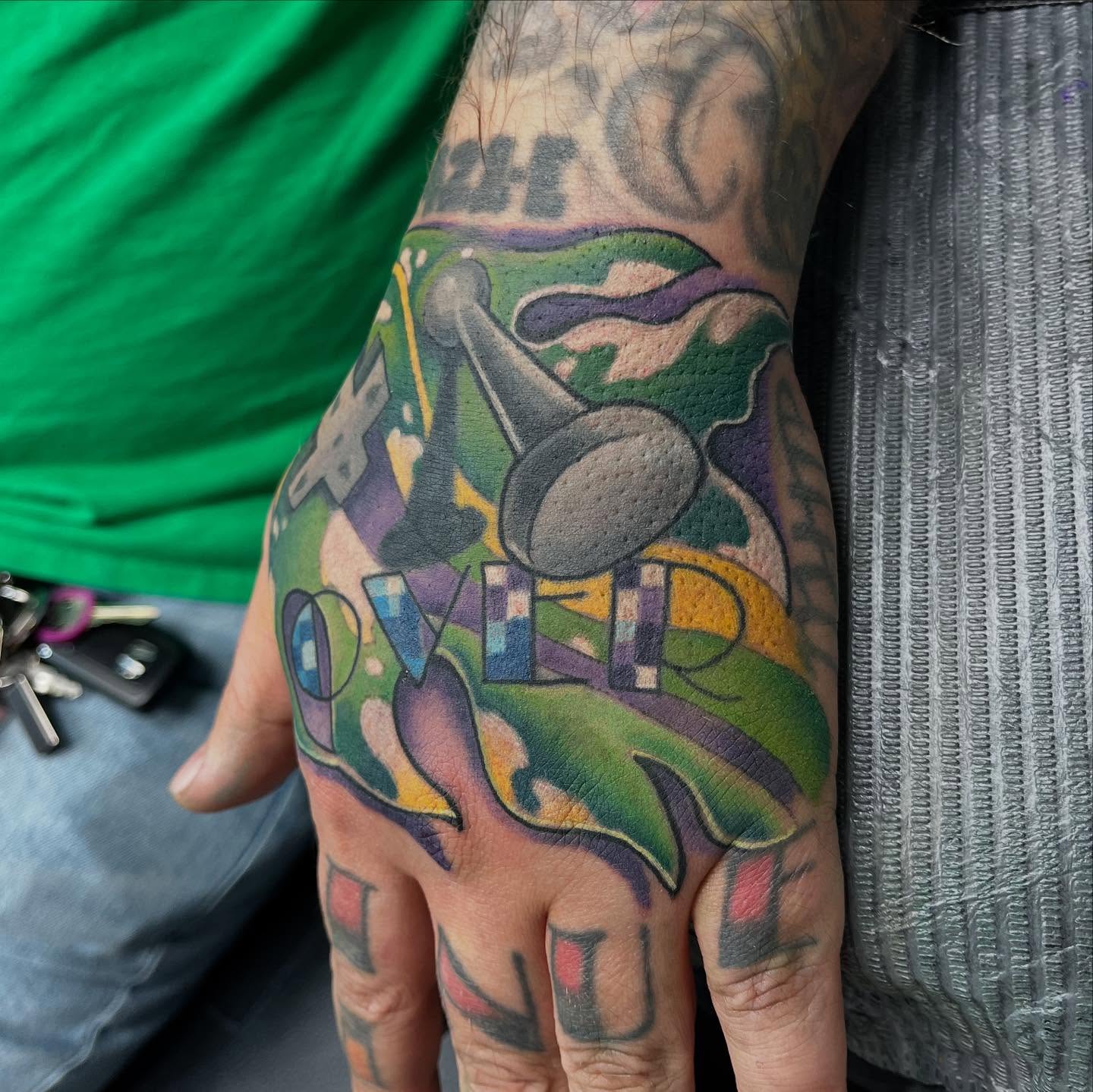 Abstract landscape new school tattoo on the hand by scottyjstattoos