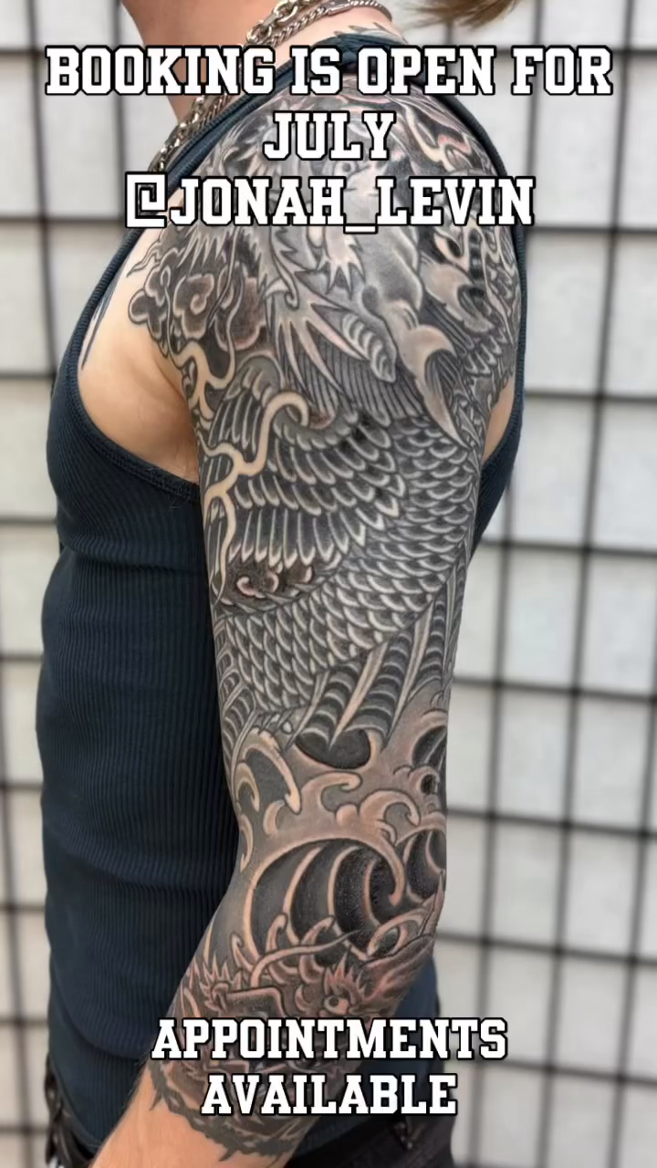 Full sleeve dragon and waves tattoo Japanese tattoo on the upper arm by Mister Joe Joe Frisco Tattoo, San Francisco, California
