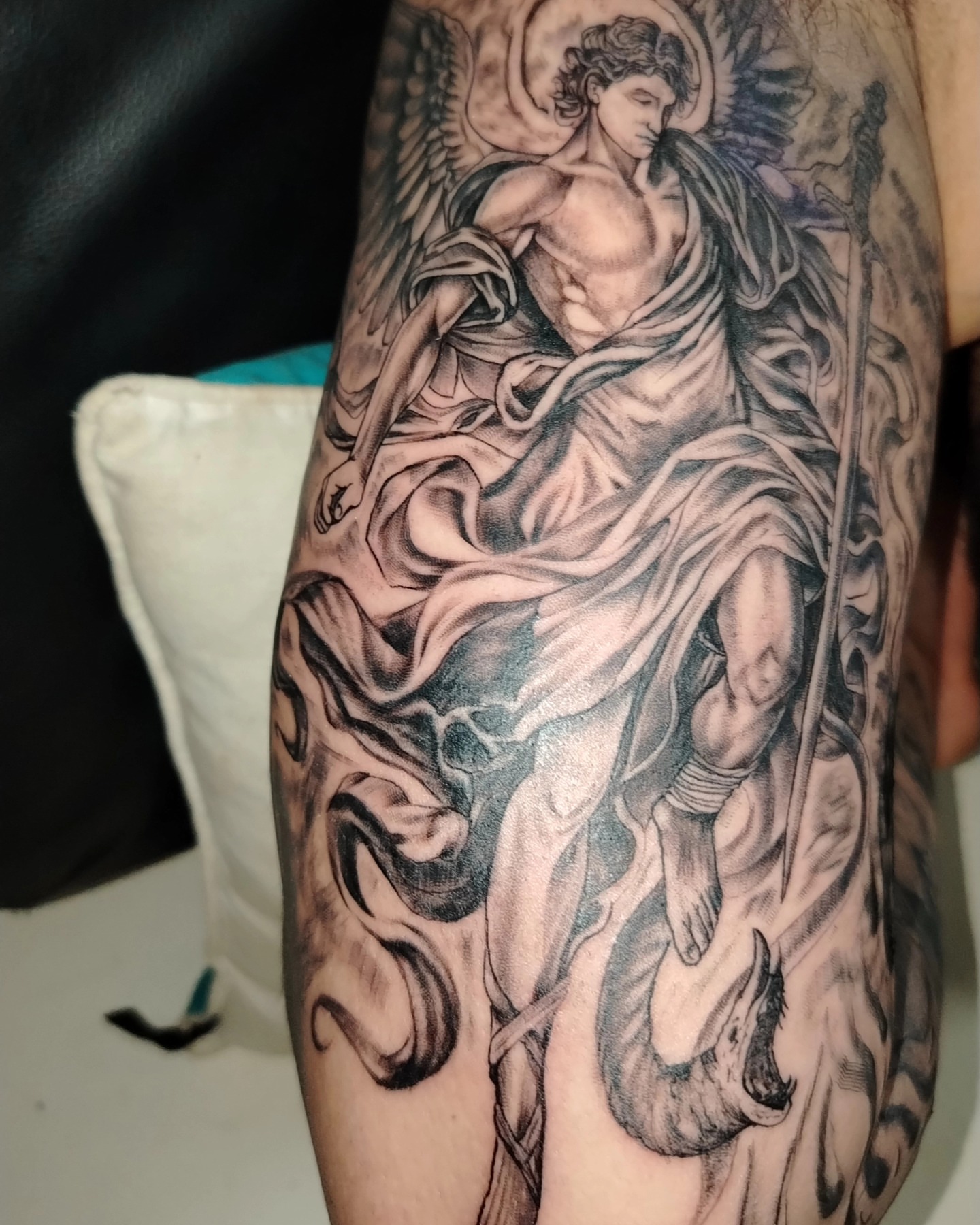 Angel with sword realism tattoo on the forearm by Alexander Tattooink