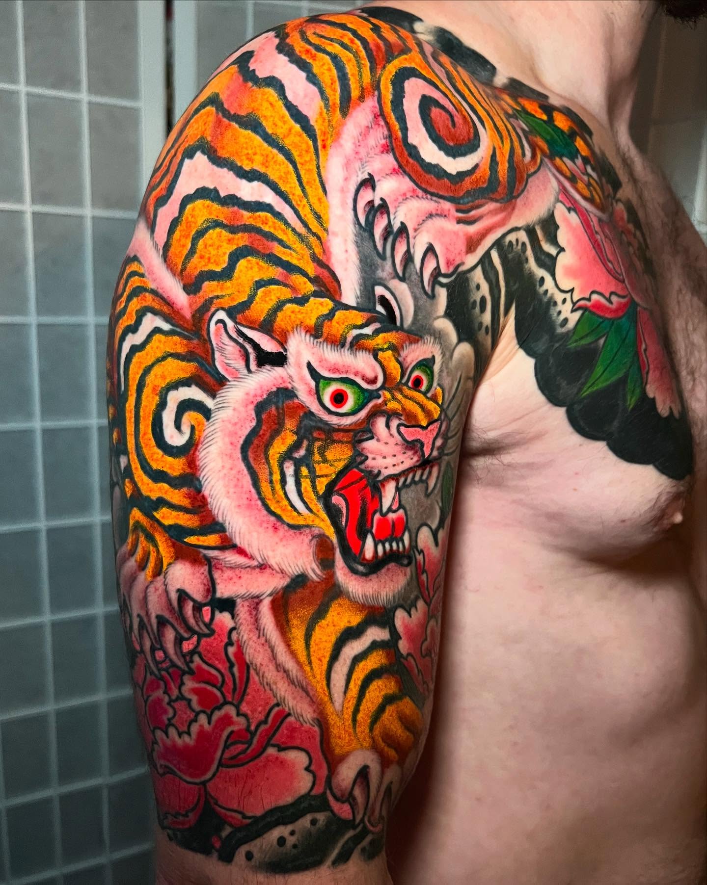 Tiger japanese irezumi tattoo on the upper arm by Barron