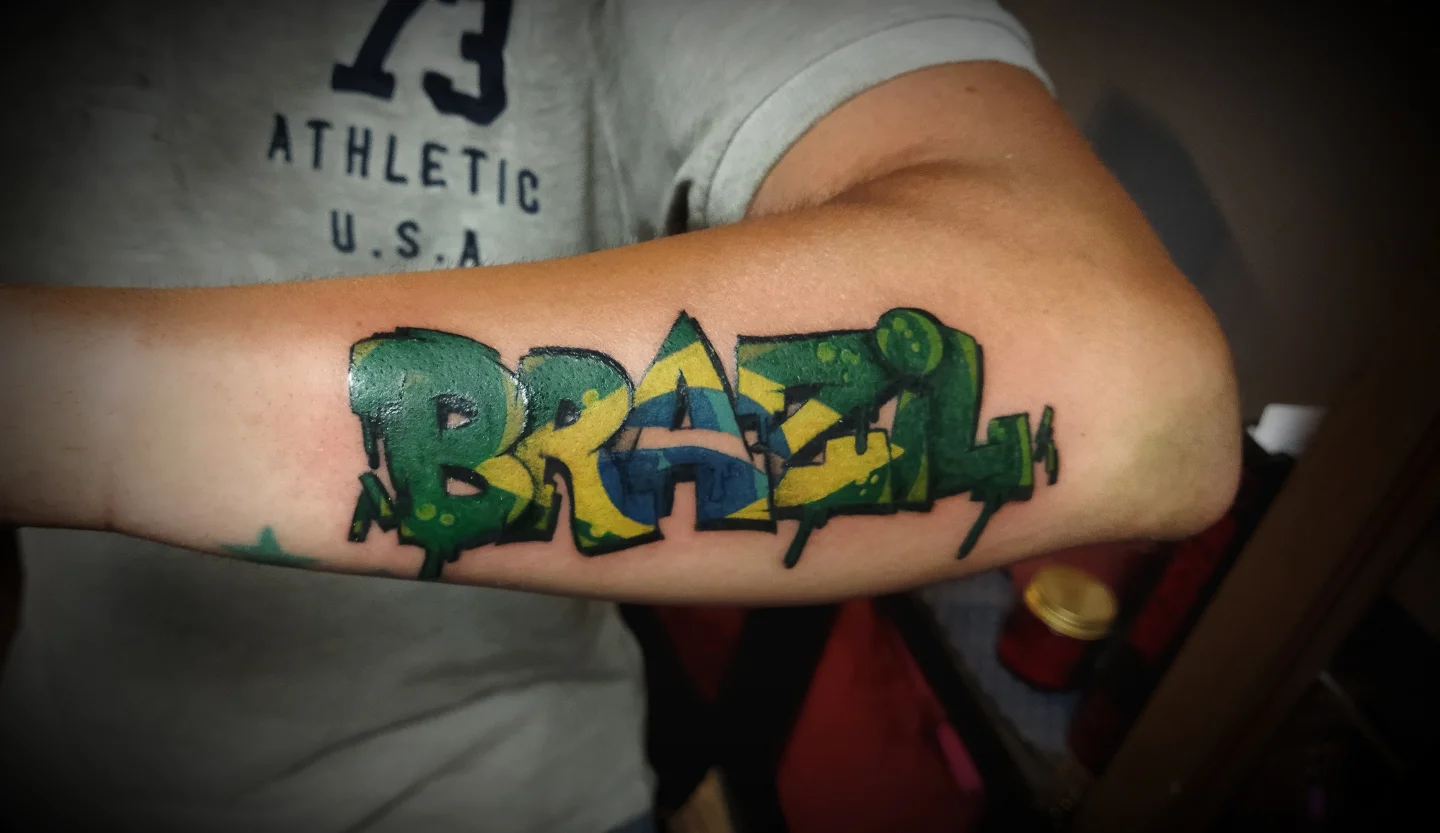 Brazil lettering script tattoo on the forearm by Ink of Winchester