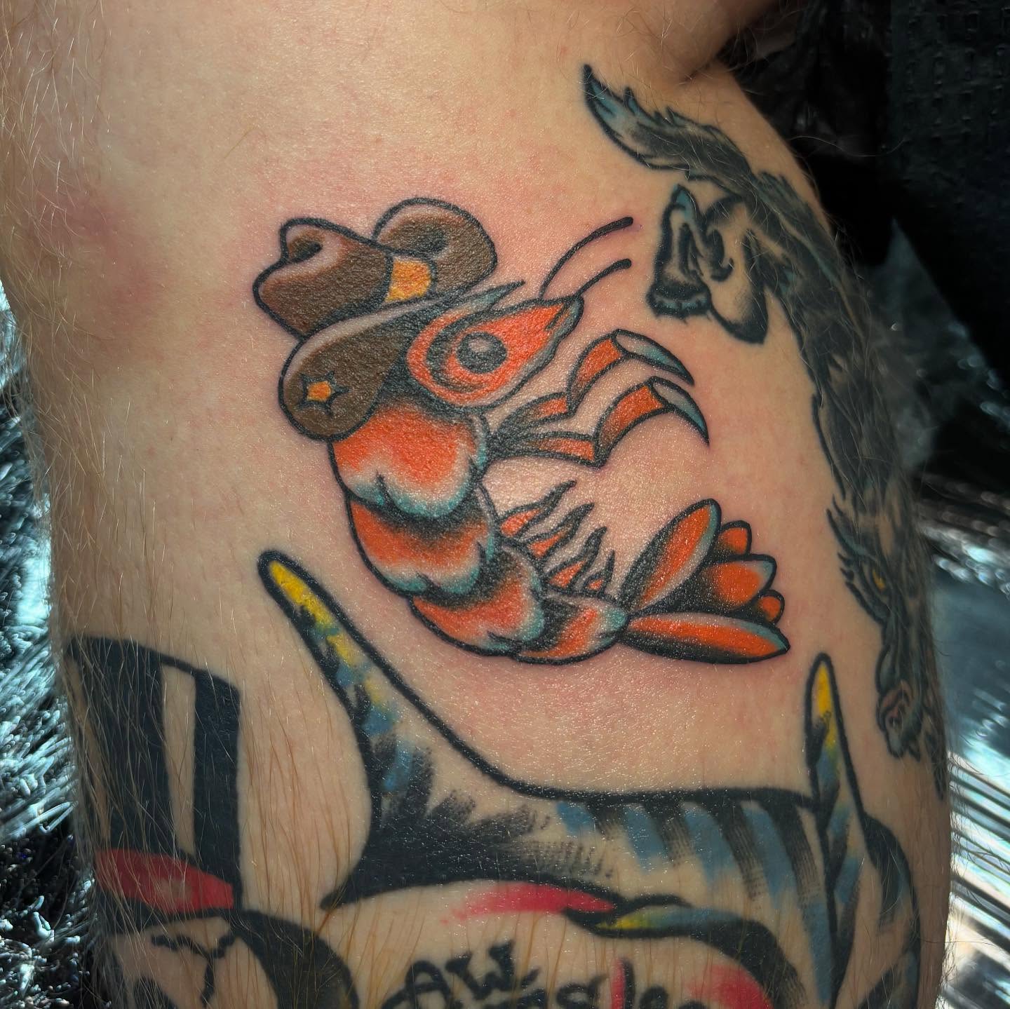 Lobster American traditional tattoo on the thigh by Nick Tate