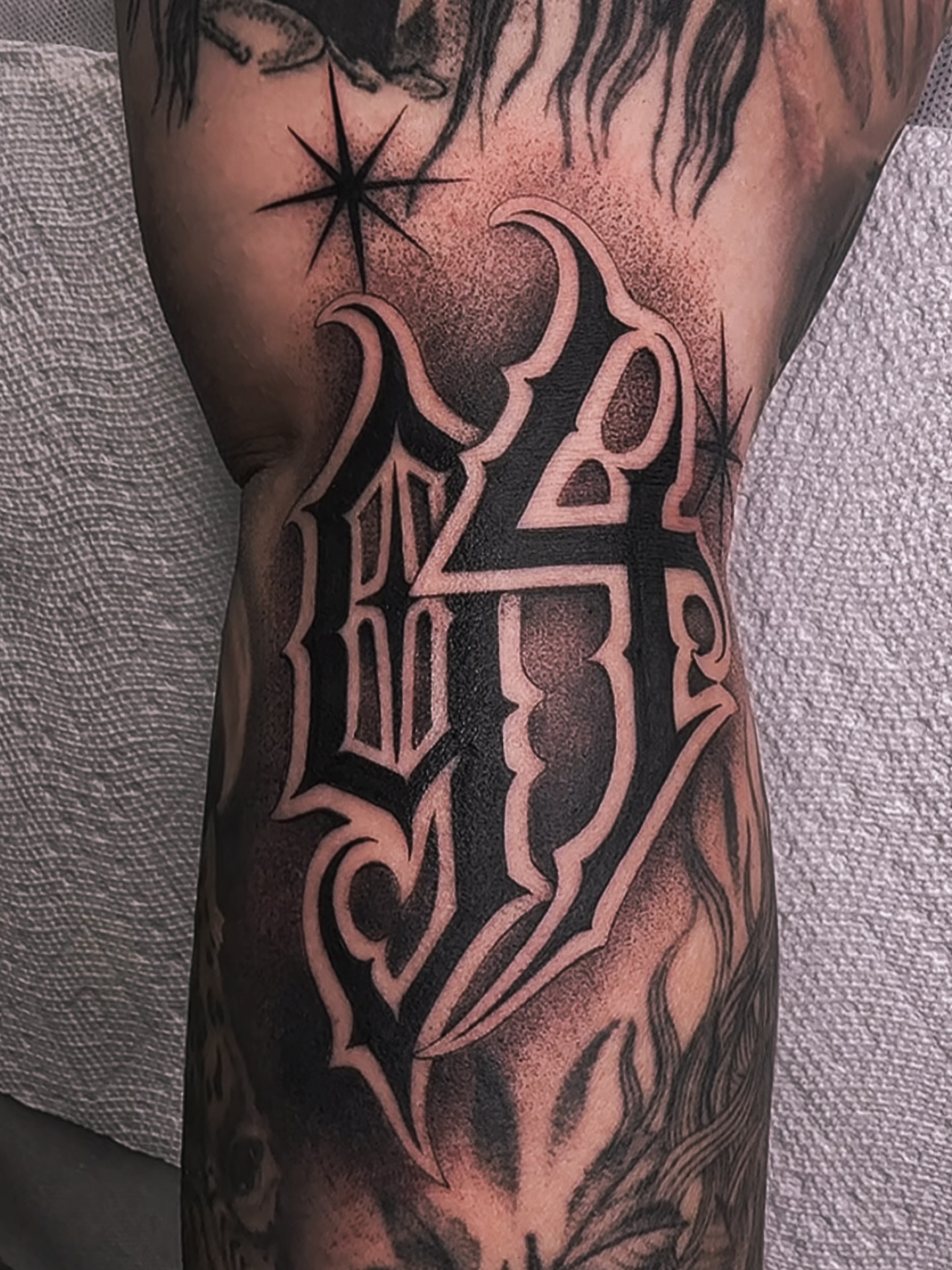 Lettering black and grey tattoo on the forearm by Tattoos.byDahlia, Austin, Texas